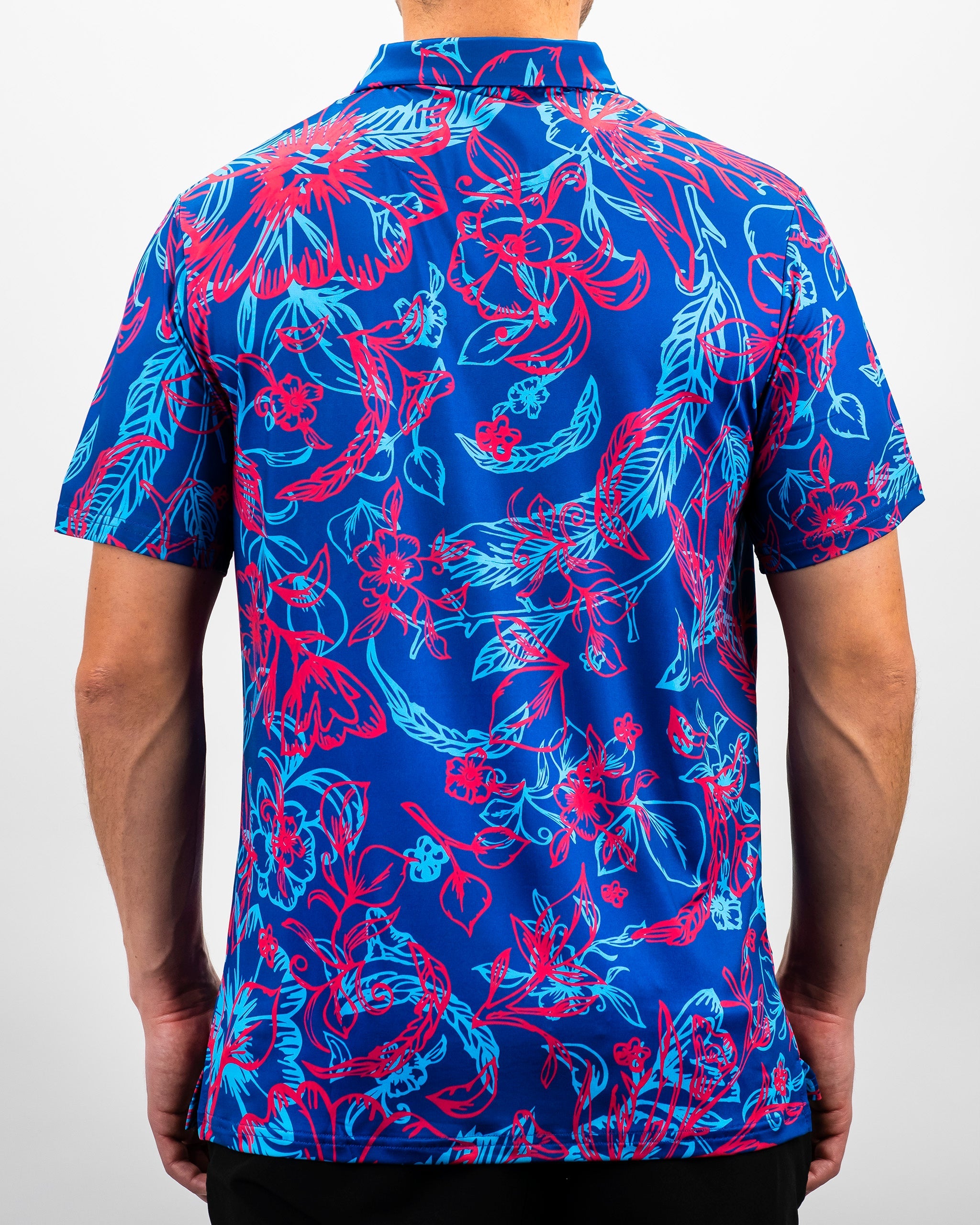 Bold floral-patterned Cabo Colada golf shirt in vibrant blue and pink, designed for stylish golfers on the course.