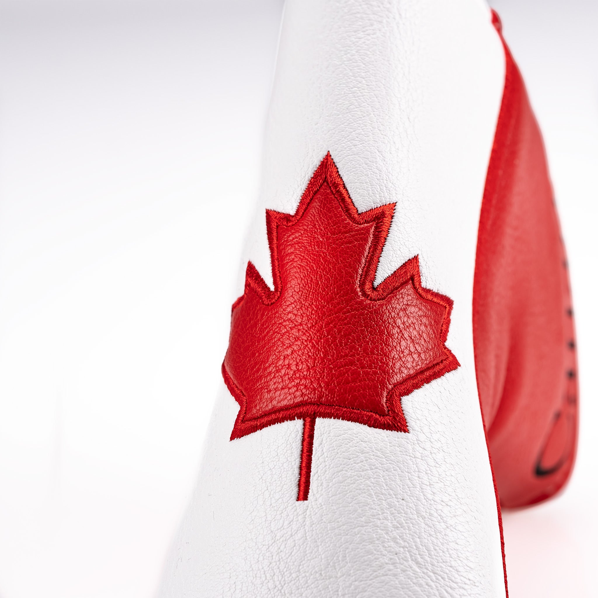 Canada blade putter cover featuring a prominent red maple leaf design on a white leather background.