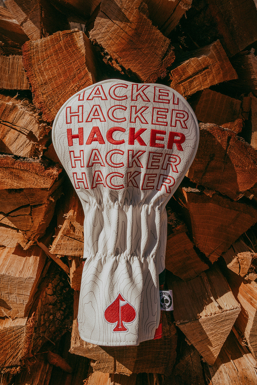 Hacker Driver Cover featuring a sleek black design with a subtle graphic, ideal for protecting golf clubs.