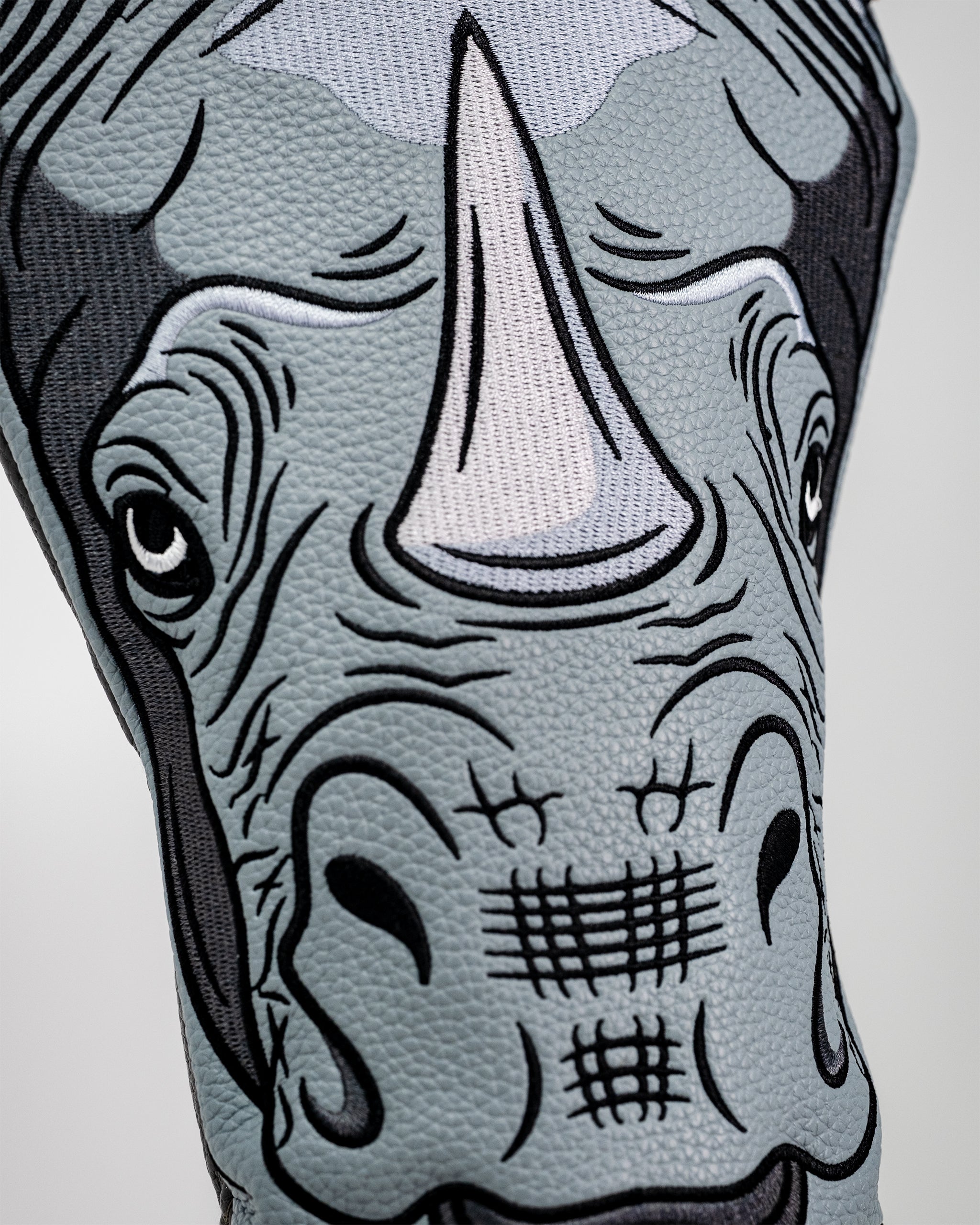 Rhino driver cover featuring a realistic rhinoceros design, perfect for golf enthusiasts.
