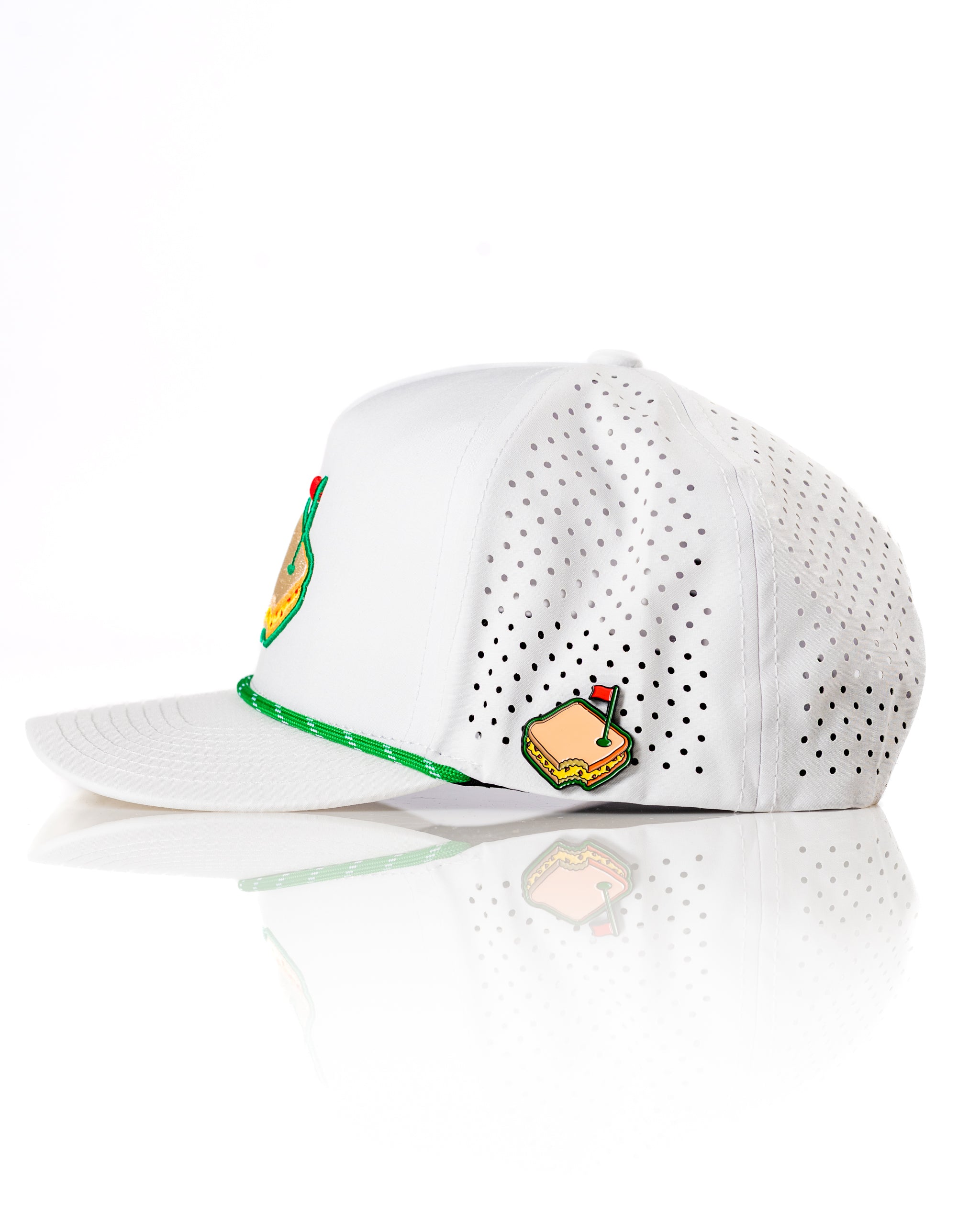 Pimento White perforated rope hat featuring a playful sandwich design and green accents for a stylish golf look.
