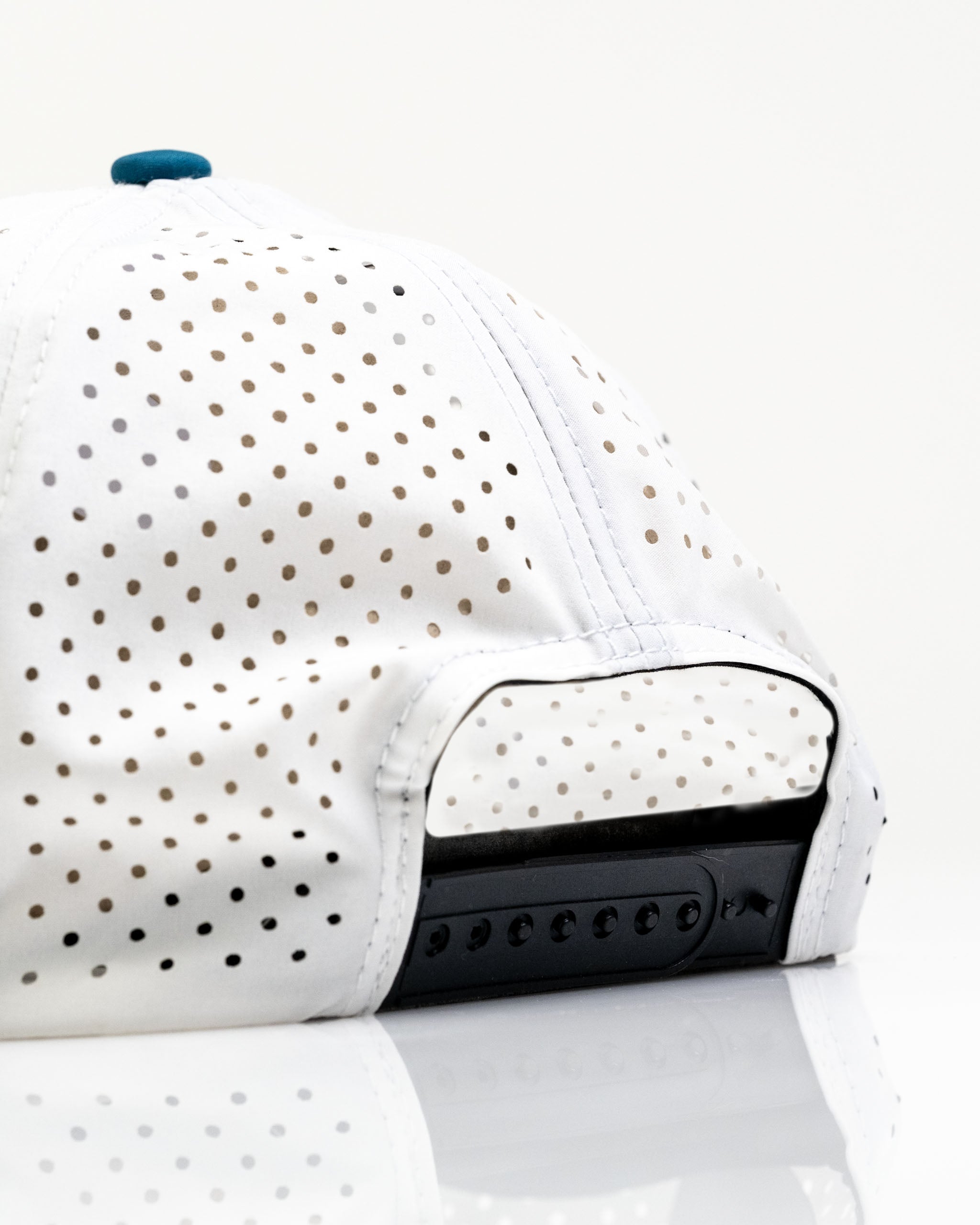 White perforated rope hat featuring a stylish design, ideal for fishing enthusiasts and outdoor activities.