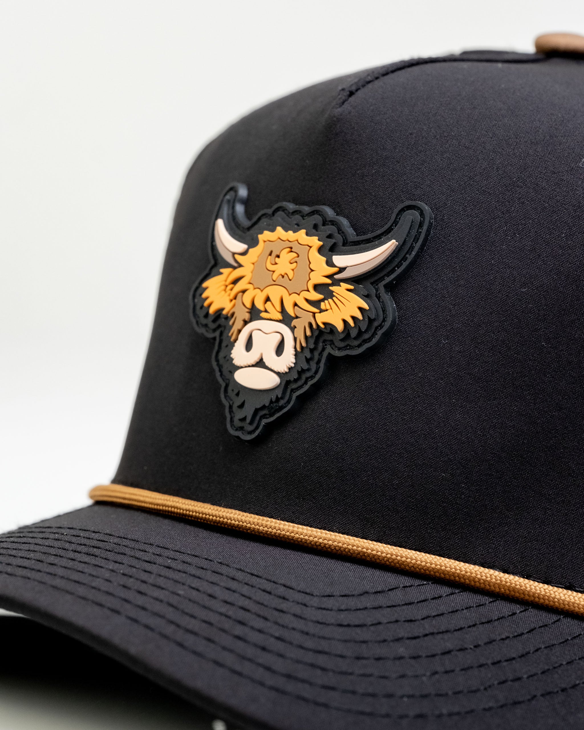 Highland Cow Collection Bundle includes a stylish cap featuring a detailed Highland cow design on the front.