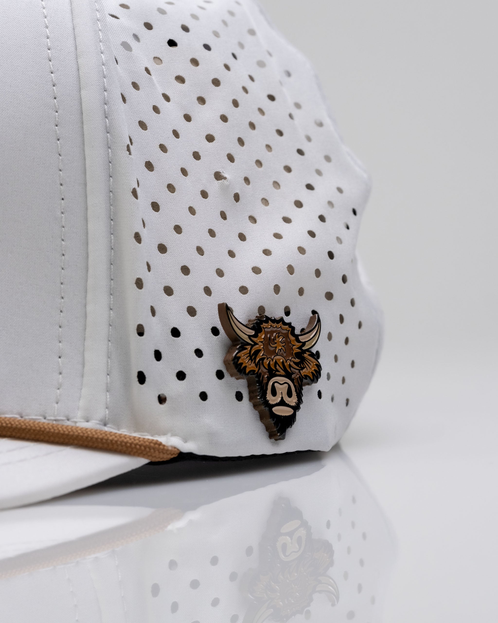 Highland Cow White perforated rope hat featuring a stylish logo and breathable design for golfers seeking a unique look.