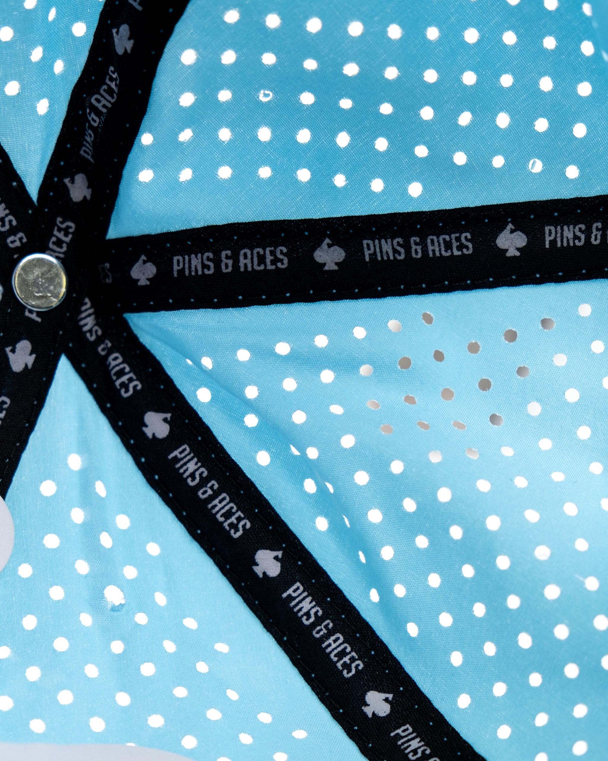 Perforated baby blue rope hat featuring a middle finger design and a branded interior band from Pins and Aces.