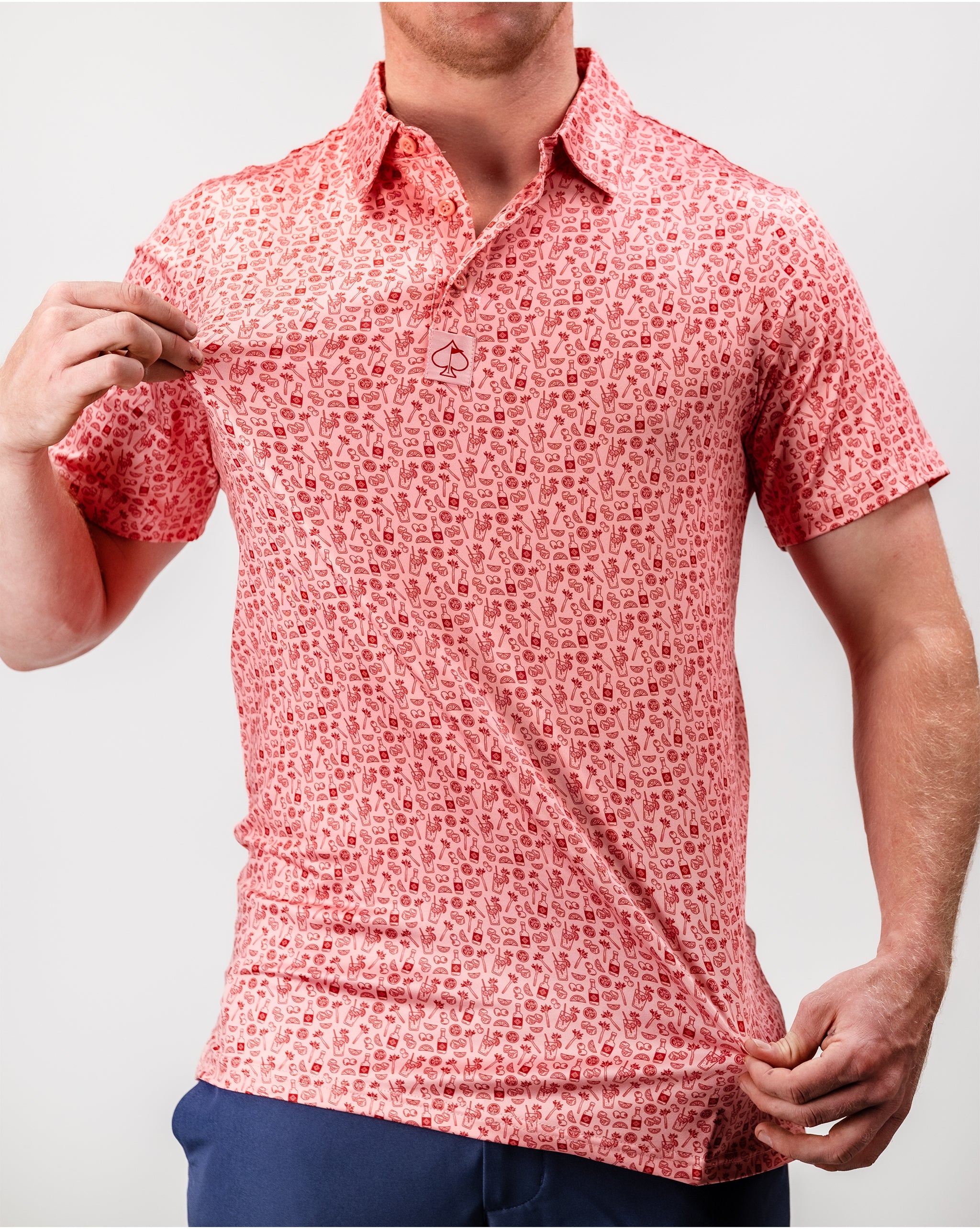 "Artistic Bloody Mary cocktail garnished with celery, olives, and a lime wedge, presented in a glass with a red splatter design."