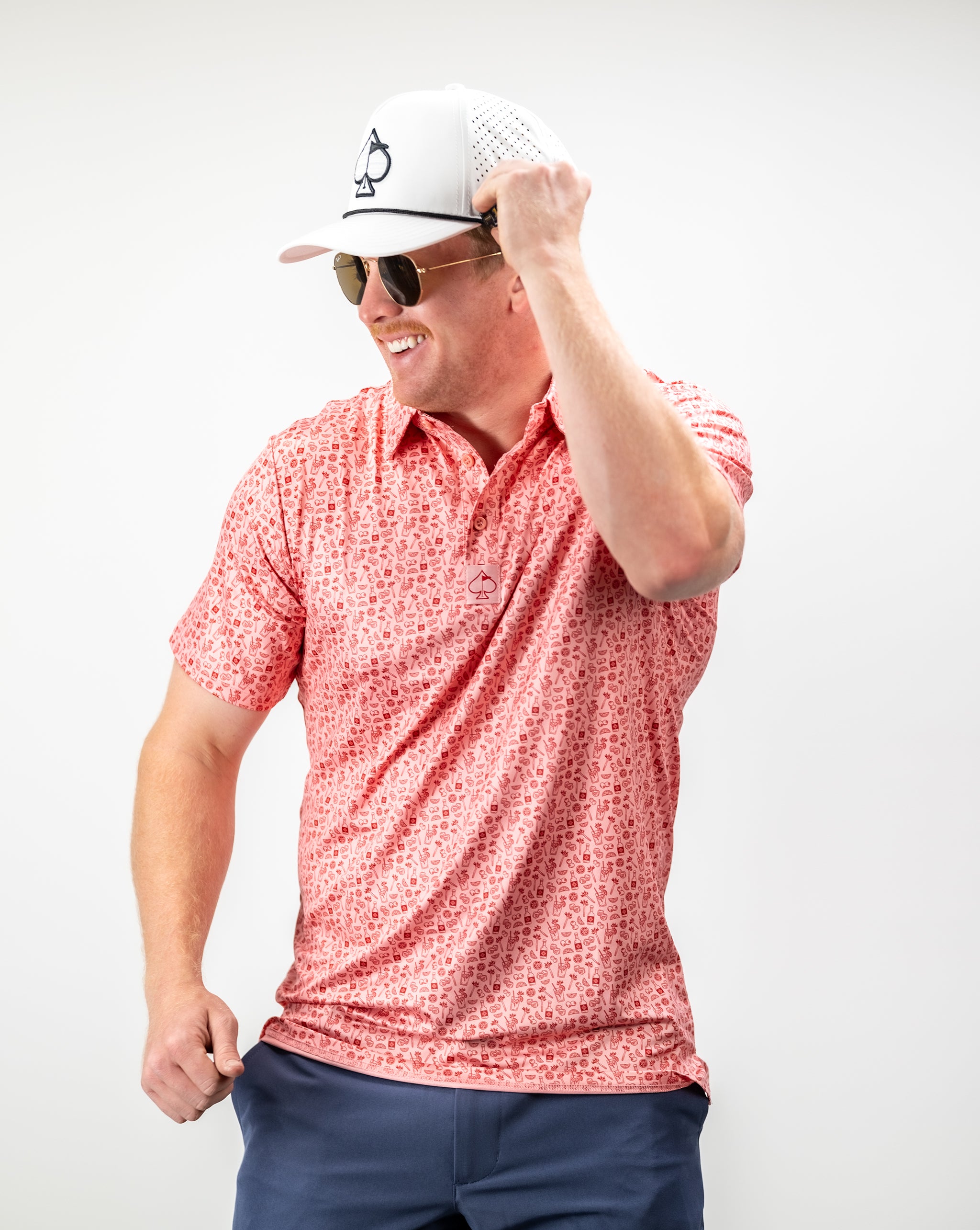 Bloody Mary cocktail garnished with celery, olives, and lime on a rustic wooden table.