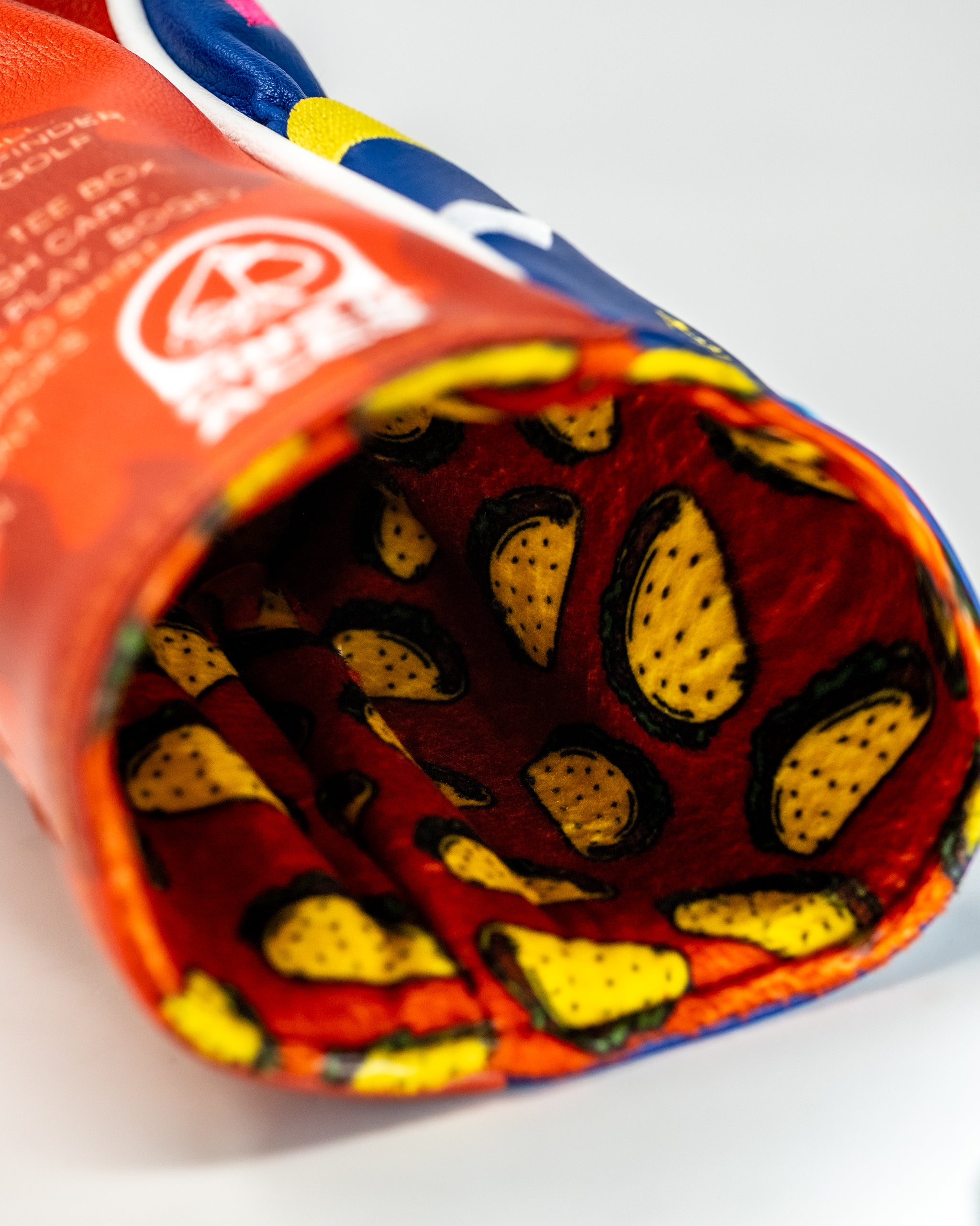 Fire Sauce Driver Cover featuring vibrant Taco Bell branding and chili pepper motifs.