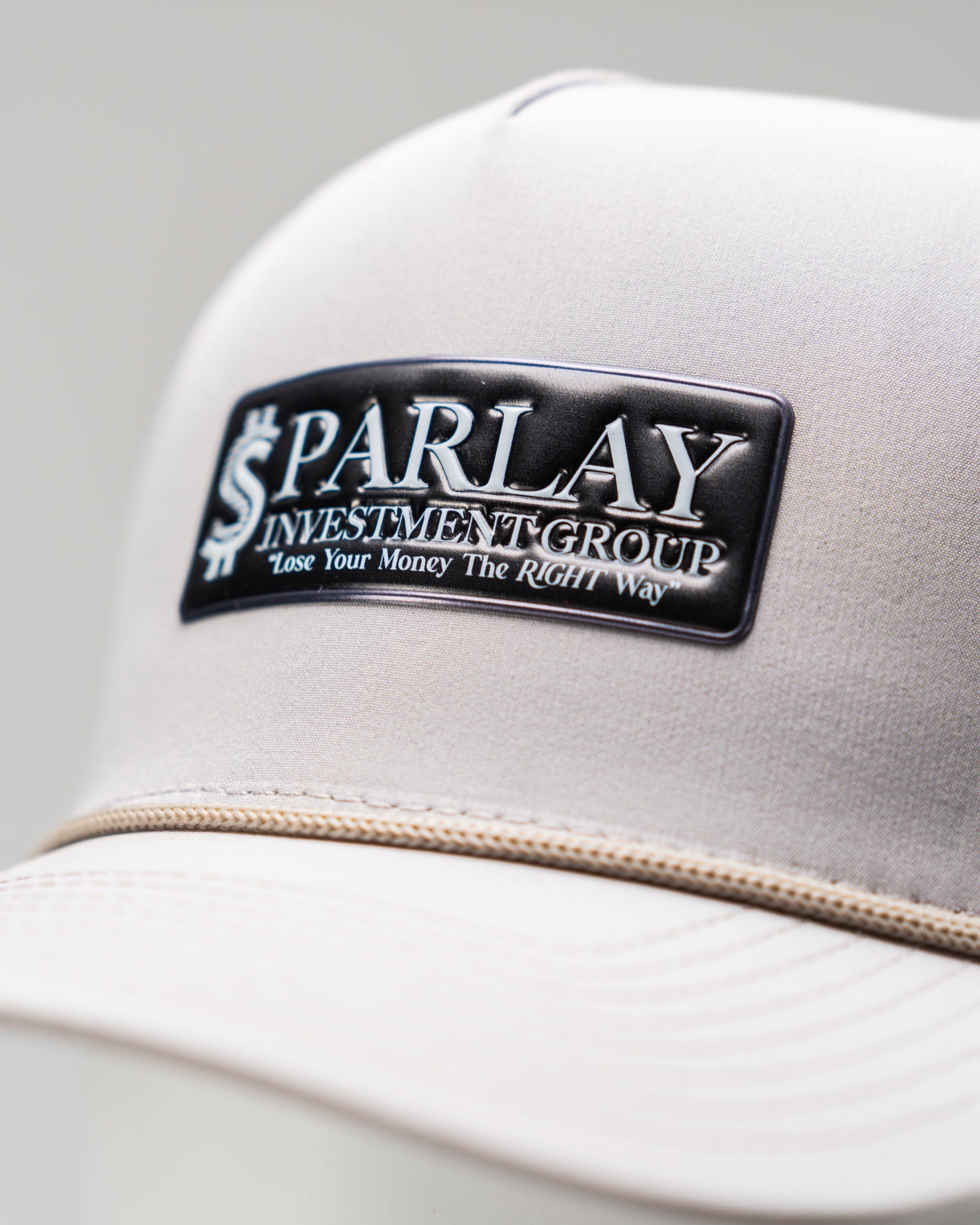 Perforated rope hat in bone color featuring the Parlay Investment Group logo.
