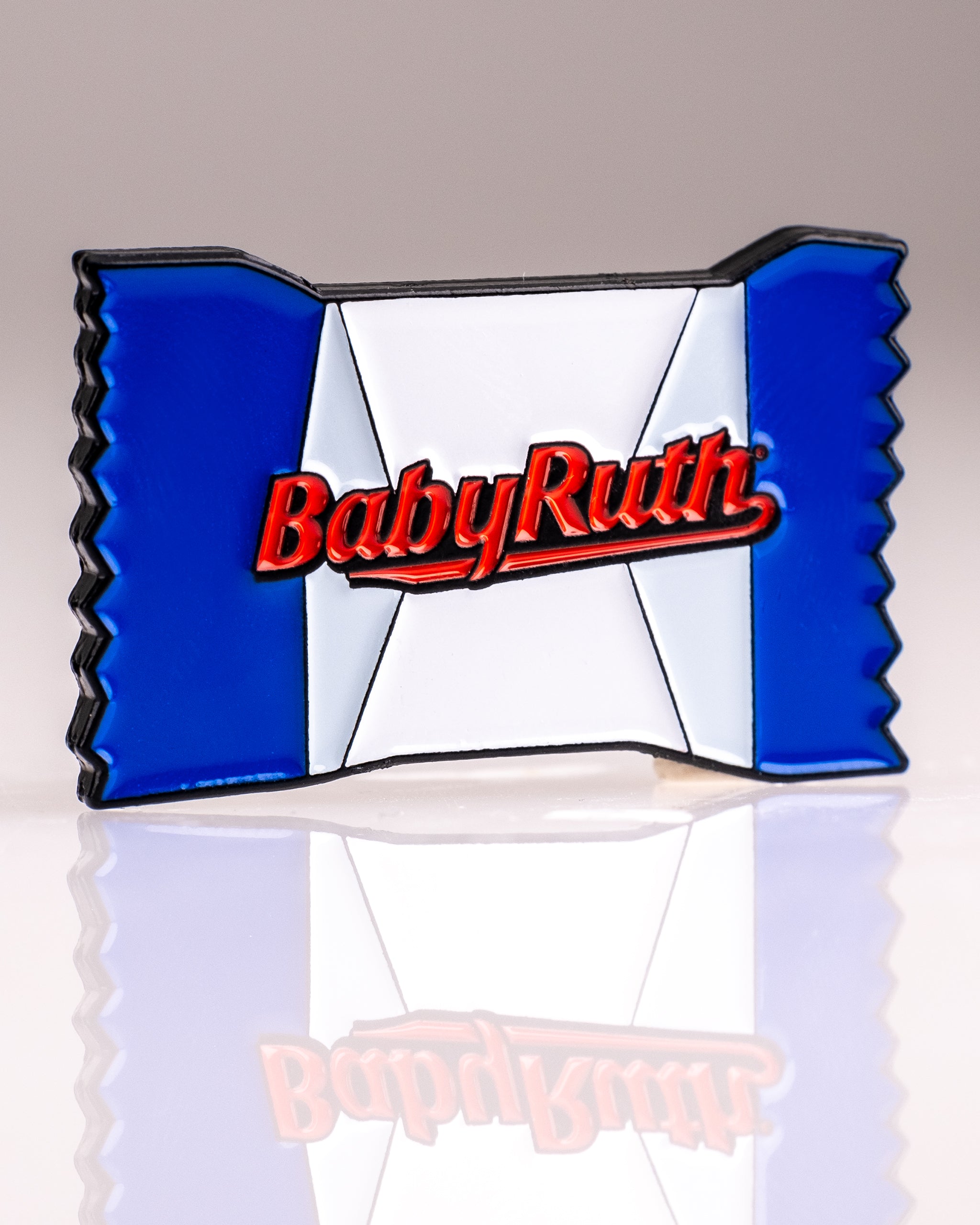 Baby Ruth® ball marker featuring an iconic candy logo design on a circular metal surface.