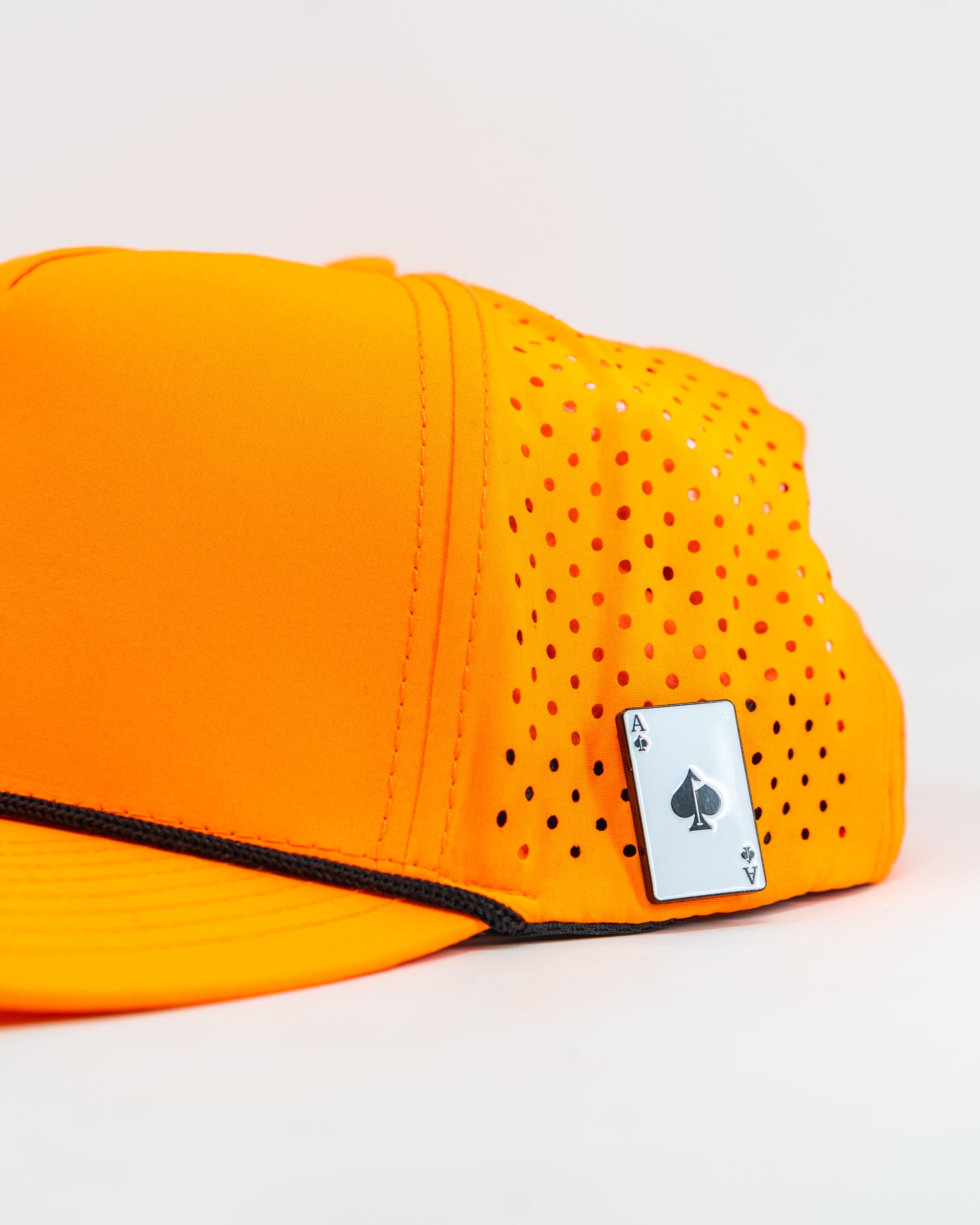 Perforated highlighter orange rope hat by Parlay, featuring a stylish design and breathable material.