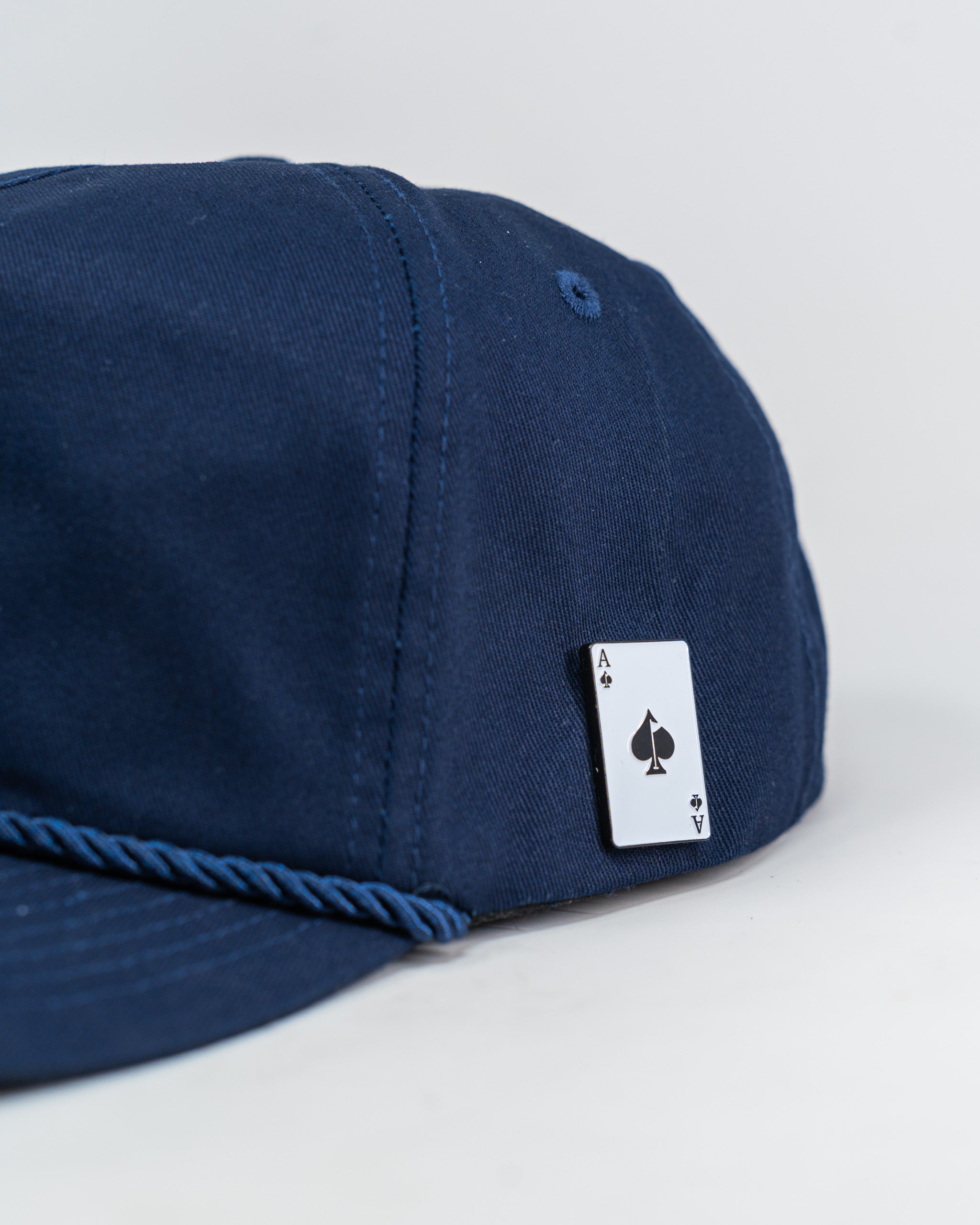 Heritage Rope Hat in Navy featuring 'Divots & Dry Flies' design, perfect for outdoor enthusiasts.