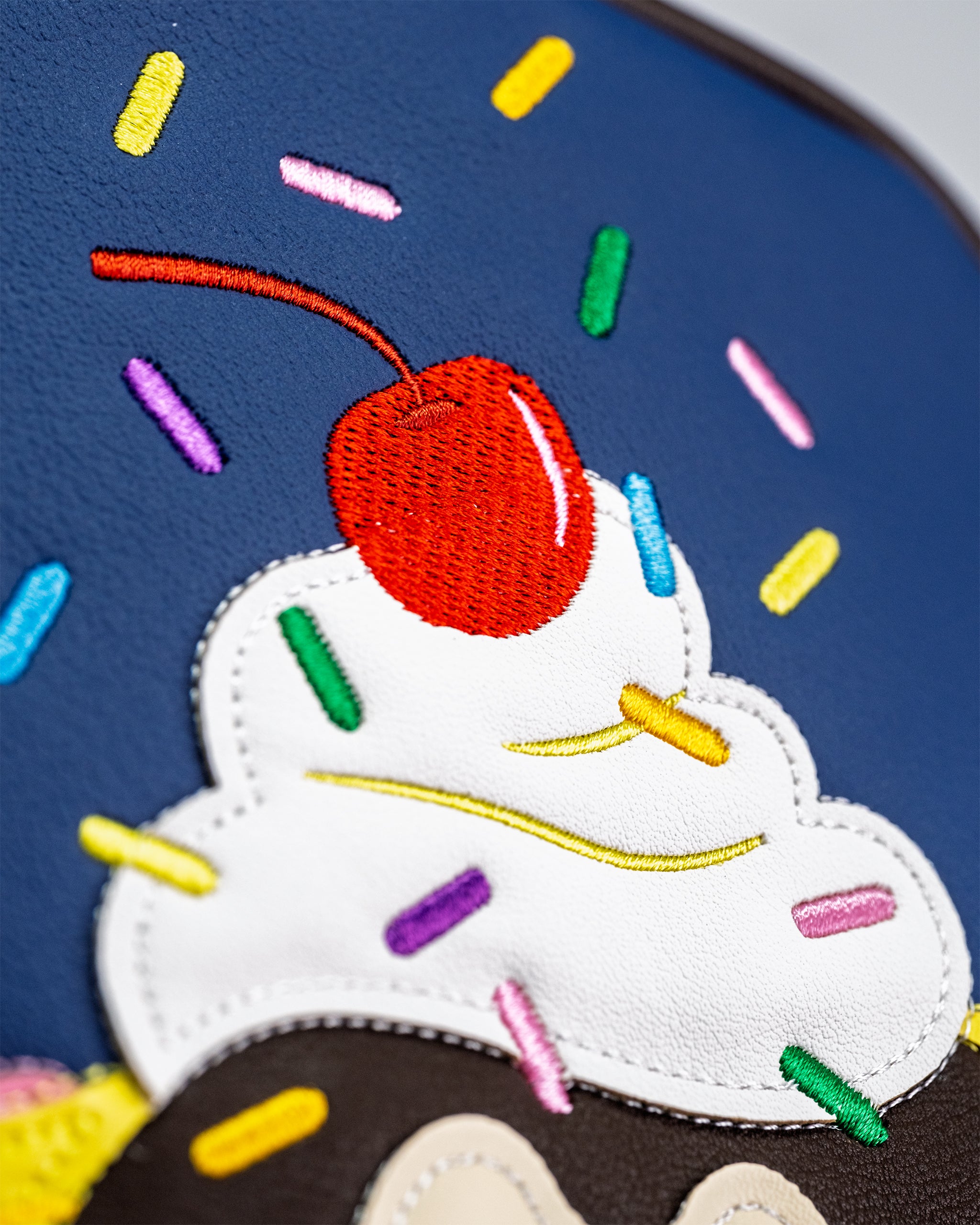 Colorful Banana Split driver cover featuring a vibrant design inspired by the classic dessert, perfect for golf enthusiasts.