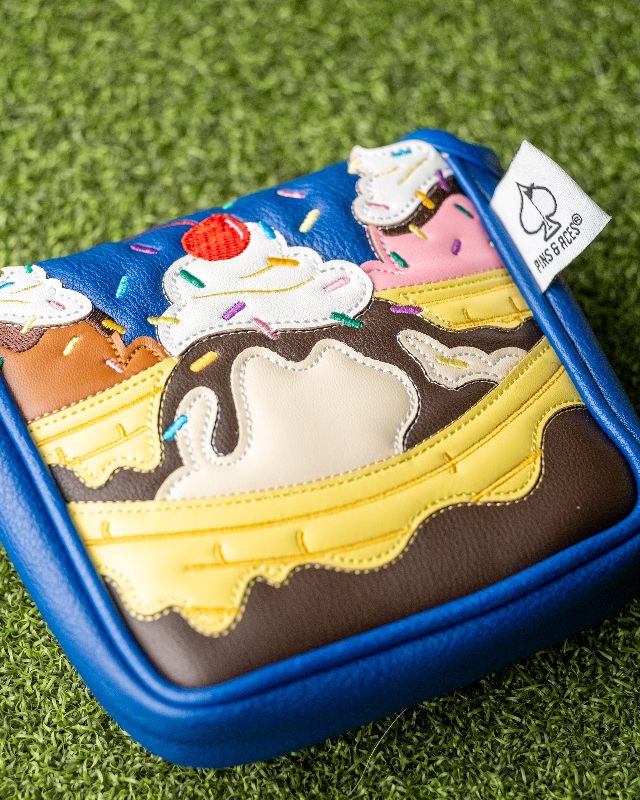 Alt text: Colorful banana split design mallet putter cover with a soft, padded exterior, perfect for golf enthusiasts.