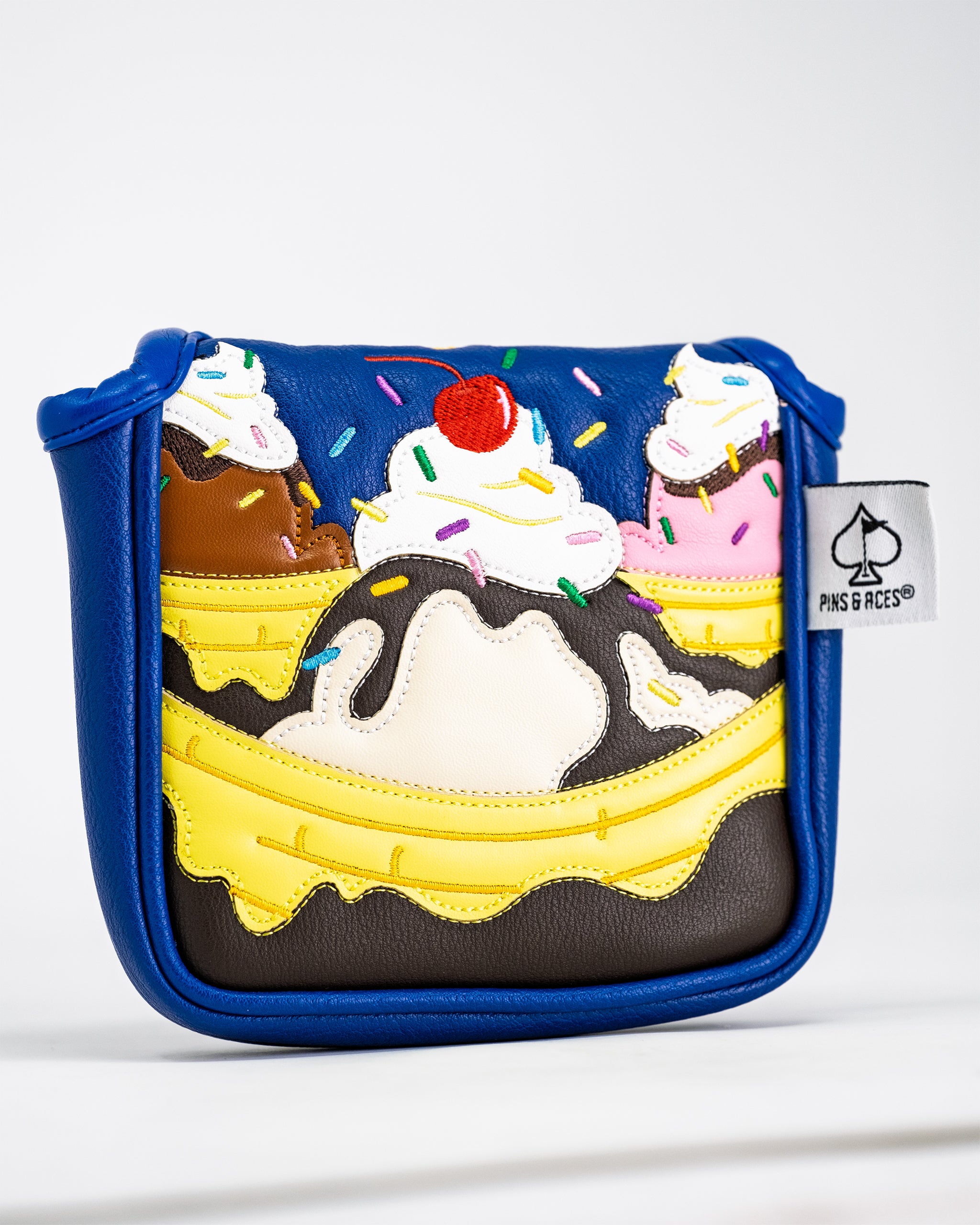 Banana Split mallet putter cover featuring a colorful dessert design with vibrant stripes and playful patterns.