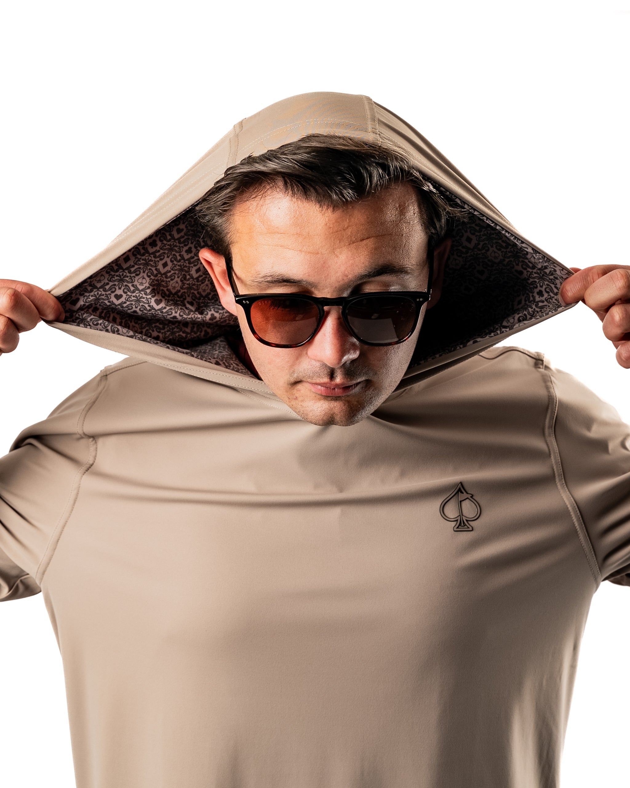 Men's performance golf hoodie in Big Blind Ash, featuring a stylish hood and subtle logo, perfect for on-course comfort.