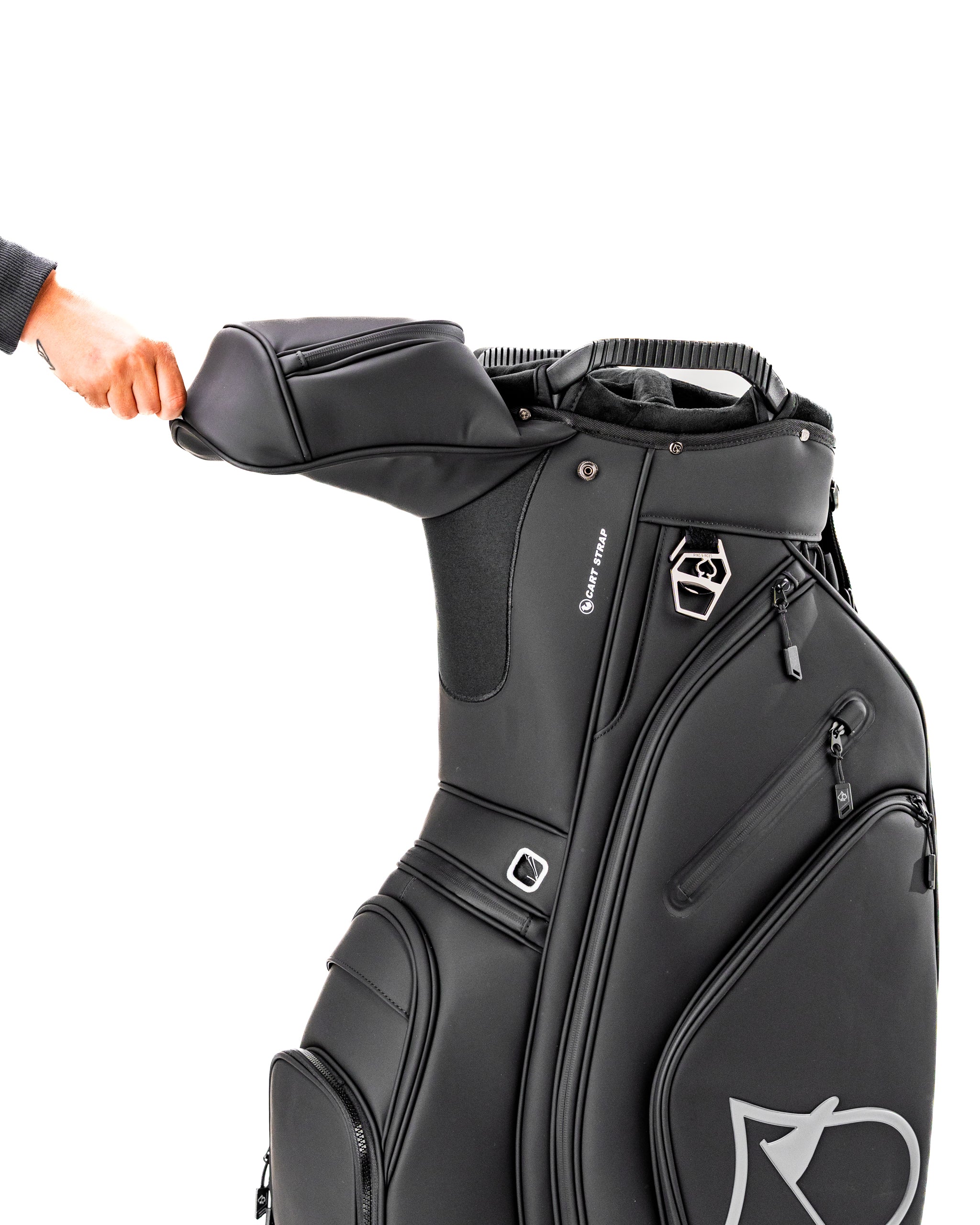 Sleek black Player Preferred™ cart bag with a hand adjusting the top, featuring multiple pockets for golf accessories.