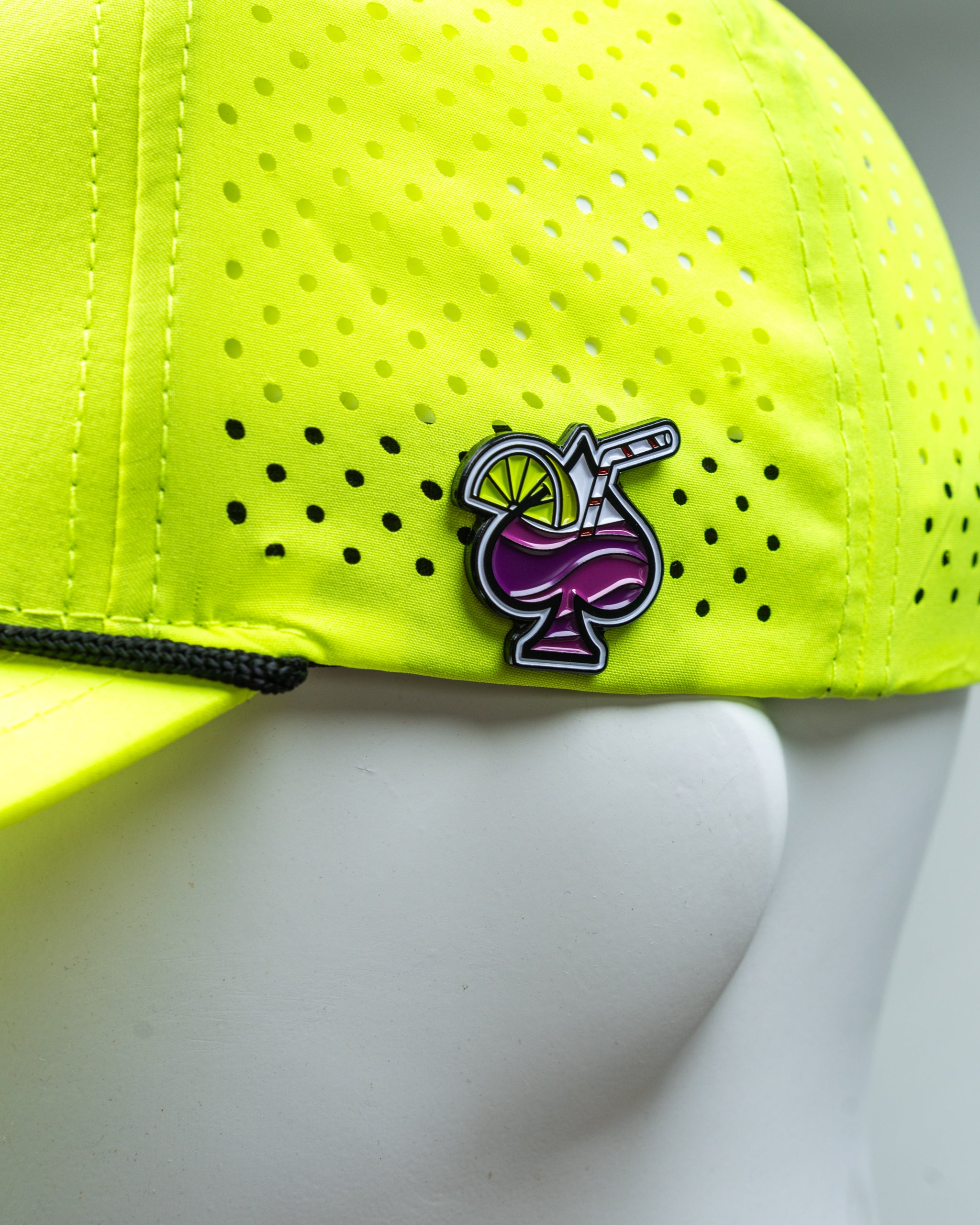 Perforated rope hat in highlighter yellow, featuring a wide brim and adjustable strap.