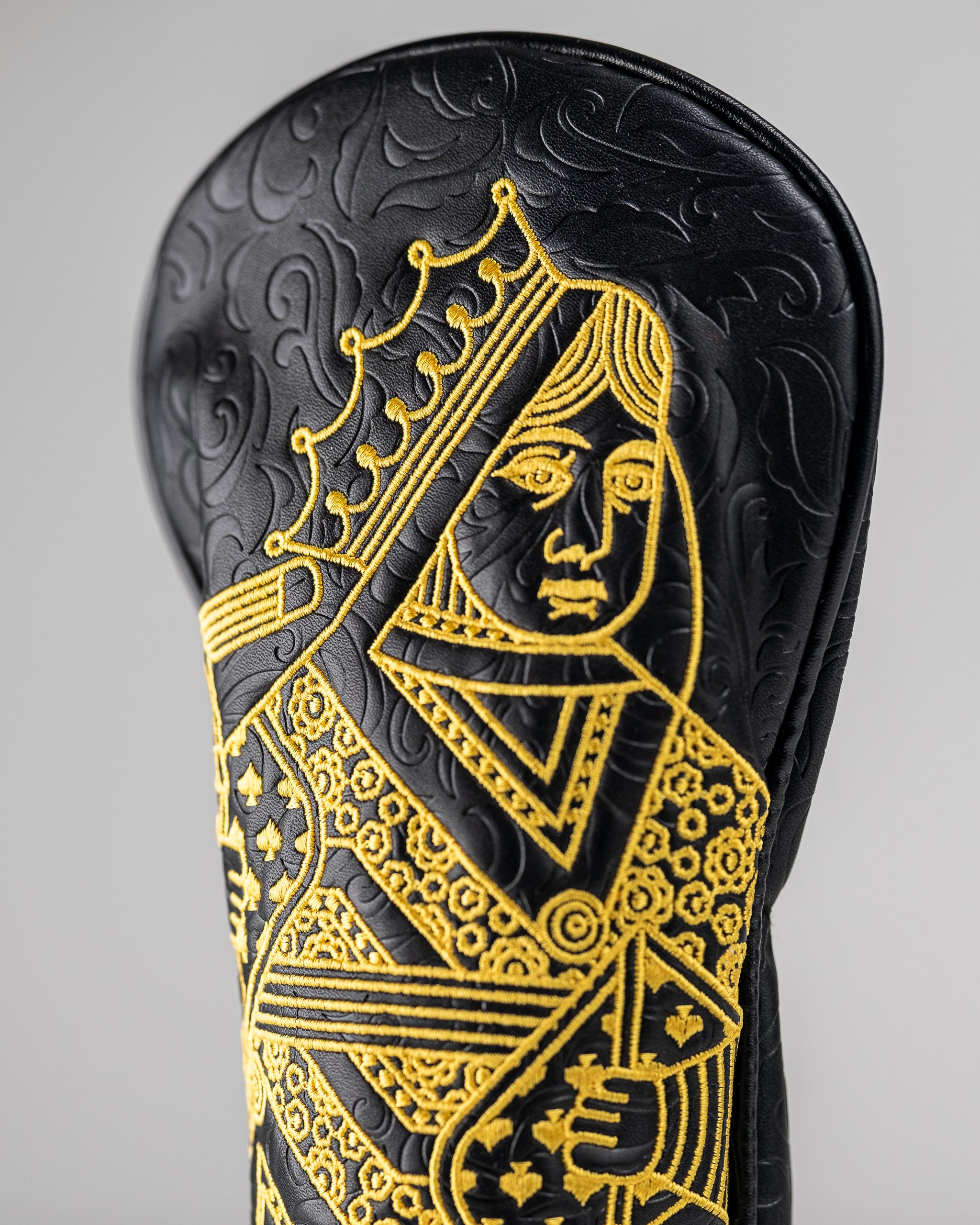 Black and gold Queen of Spades fairway cover with a sleek design, featuring a spade emblem.