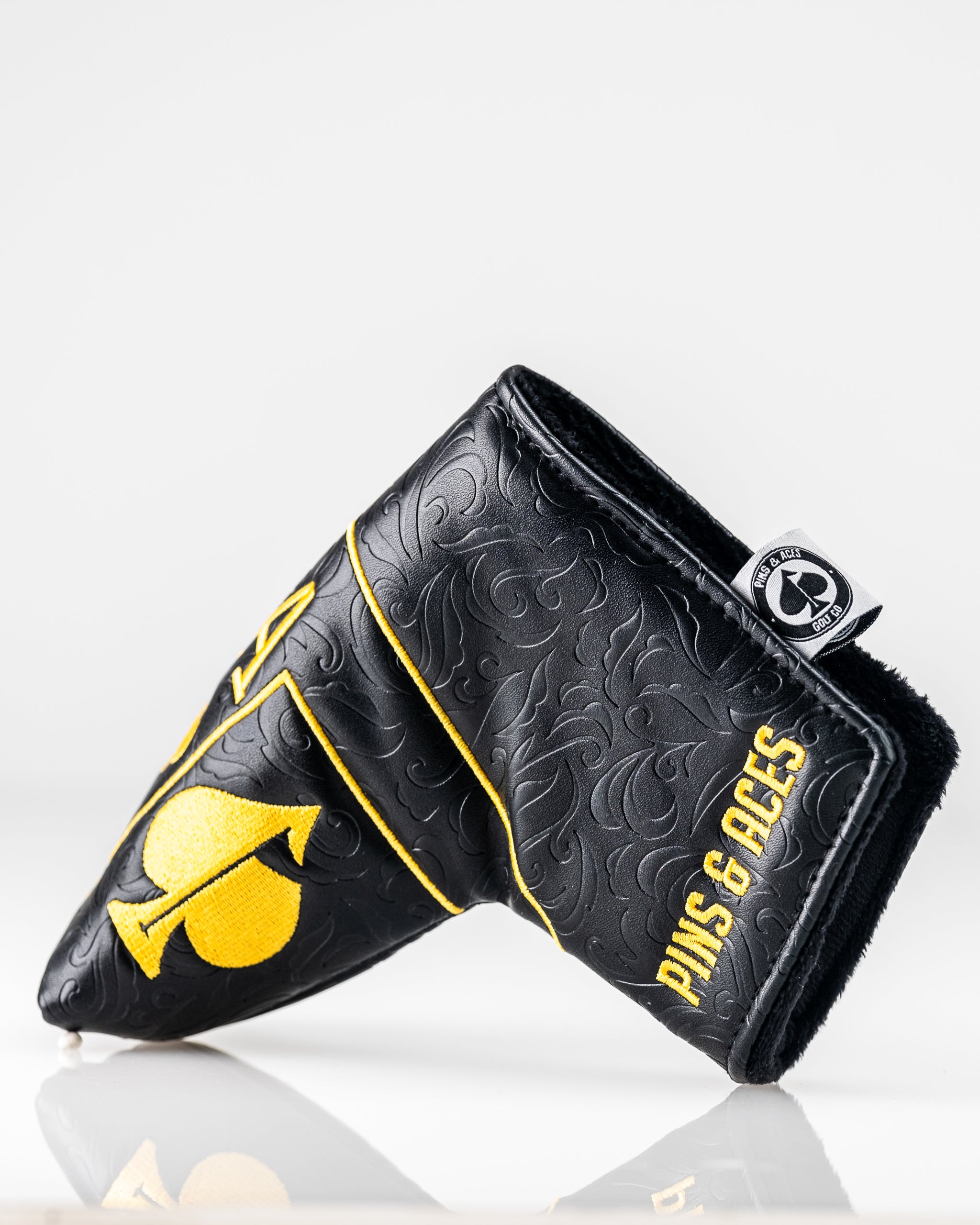 Black and gold Ace of Spades blade putter cover featuring a sleek design and durable material, ideal for golf enthusiasts.