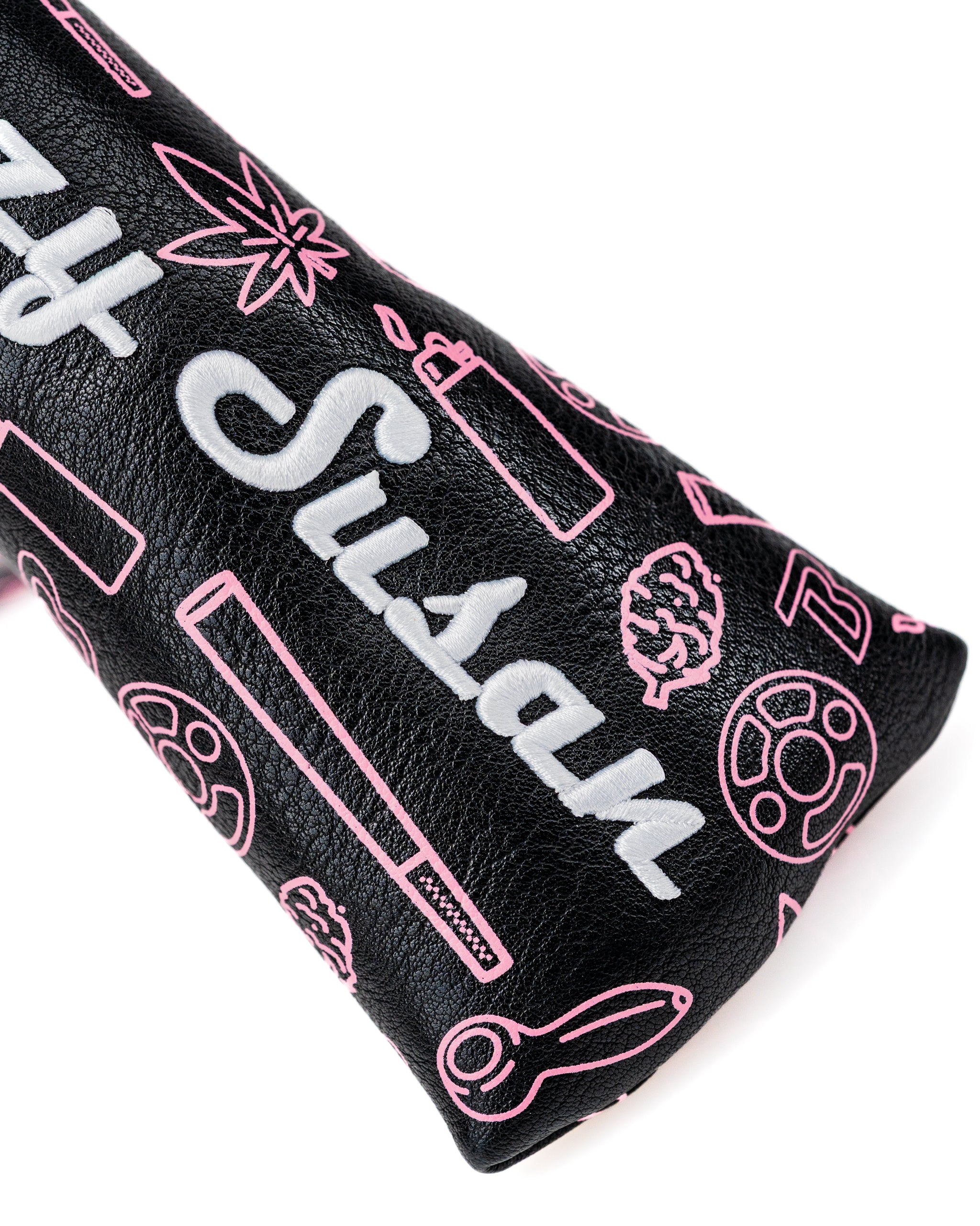 Bold black leather blade putter cover featuring vibrant pink graphics and the "Blazy Susan" logo, perfect for stylish golfers.