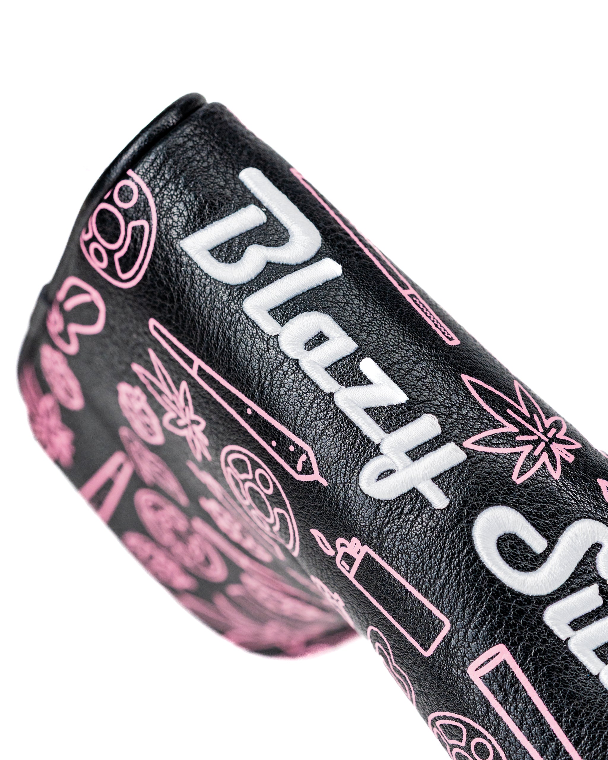 Bold black blade putter cover featuring playful pink graphics and the Blazy Susan logo, perfect for stylish golfers.
