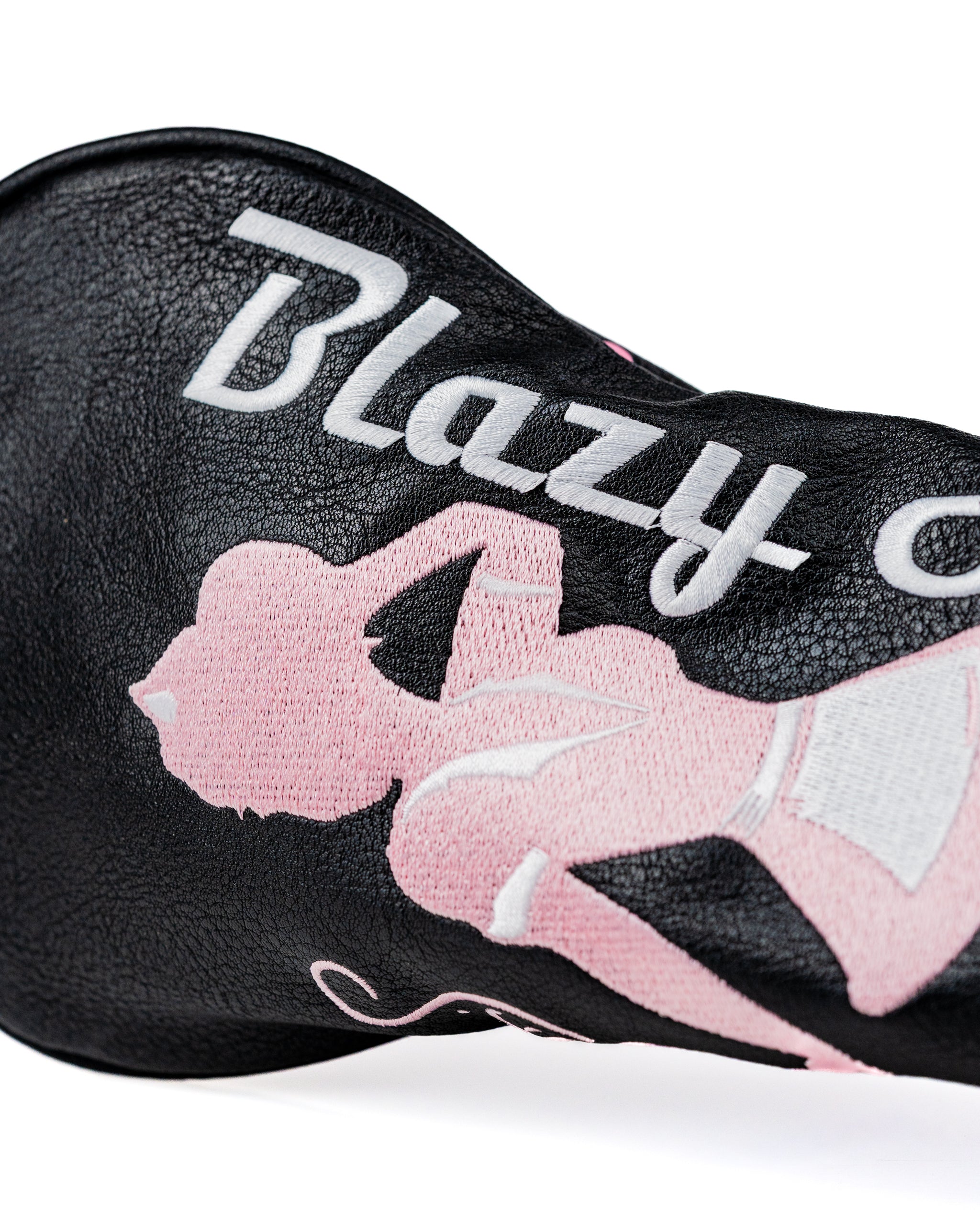 Bold black fairway cover featuring a pink silhouette design and "Blazy Susan" text, perfect for stylish golfers.