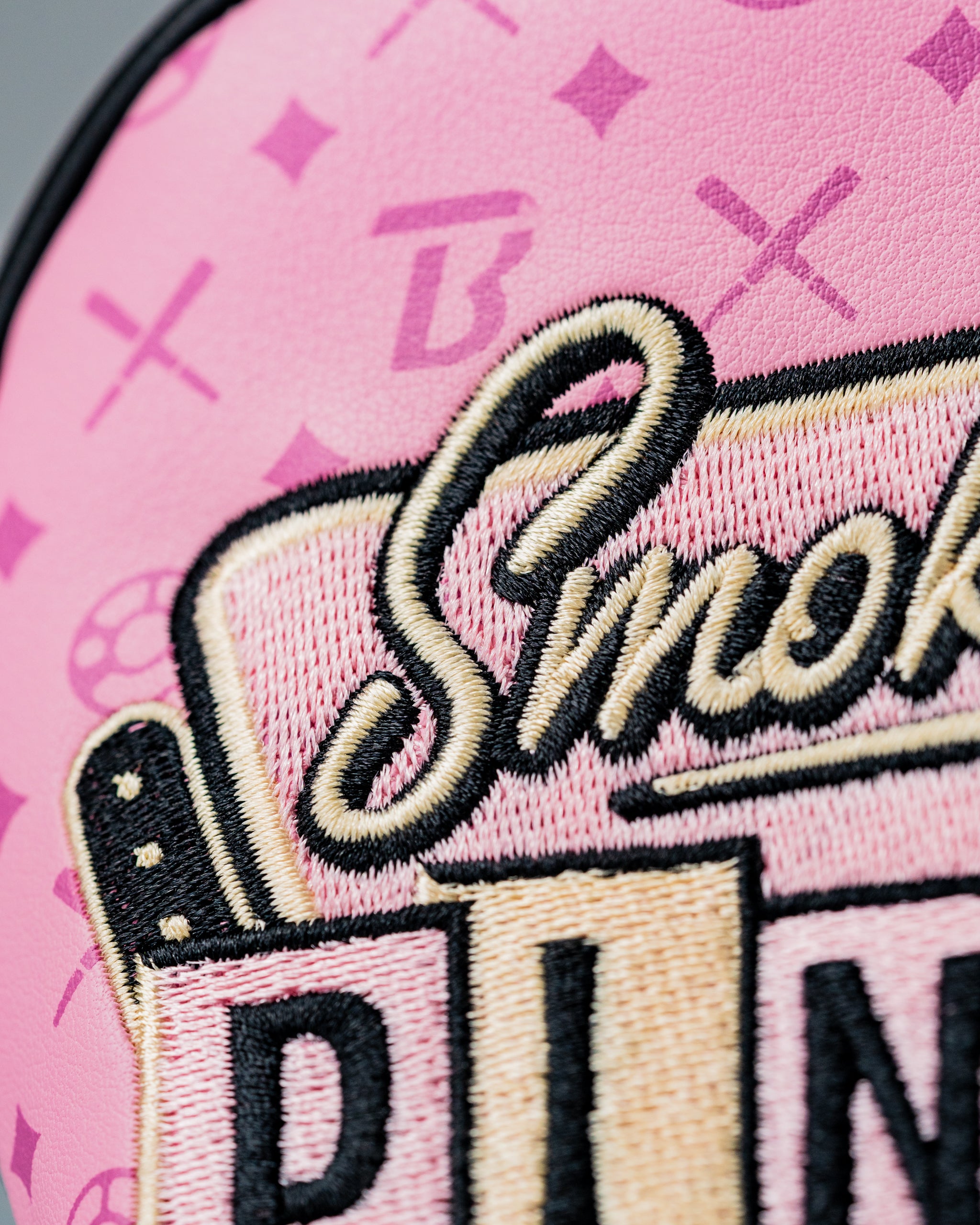 Pink hybrid golf headcover featuring bold "Smokin' PINS" embroidery and a stylish design by Pins and Aces x Blazy Susan.
