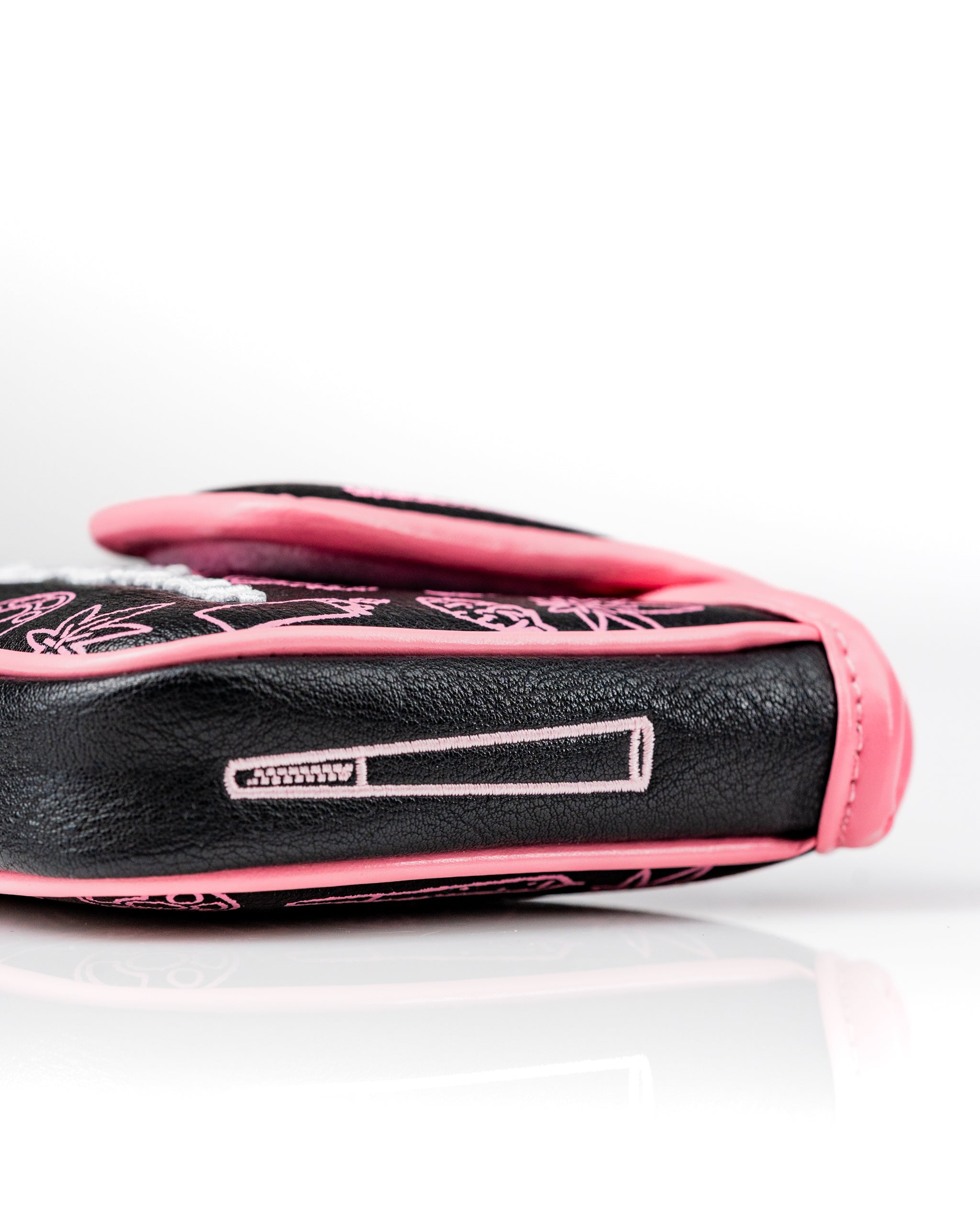 Bold black mallet putter cover featuring pink accents and unique designs, perfect for golfers wanting to stand out.