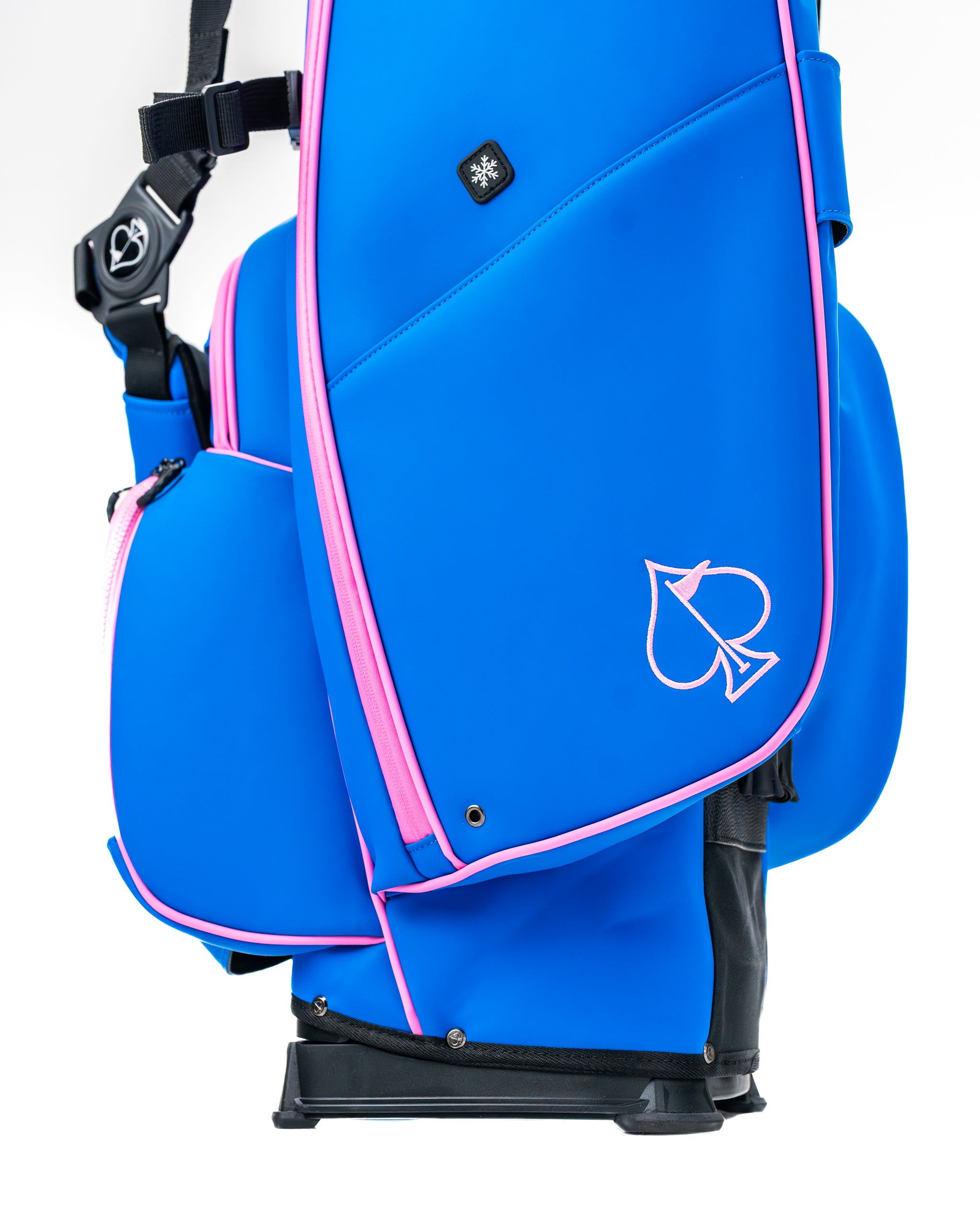 Bold blue raspberry golf bag with pink accents and a spade logo, designed for stylish and functional on-course performance.