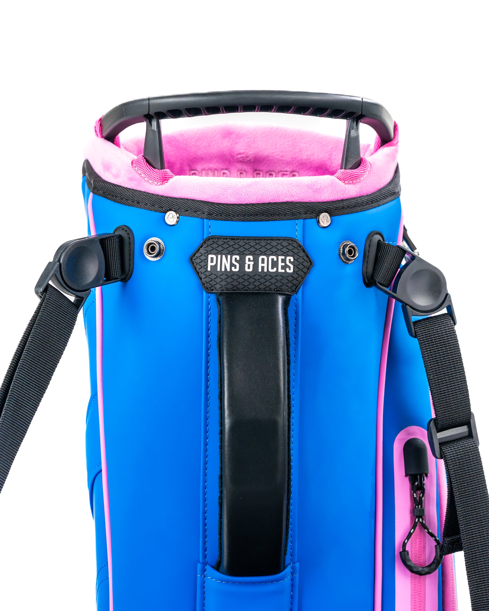 Vibrant blue raspberry golf bag with pink accents, featuring a padded top and adjustable straps for comfort.