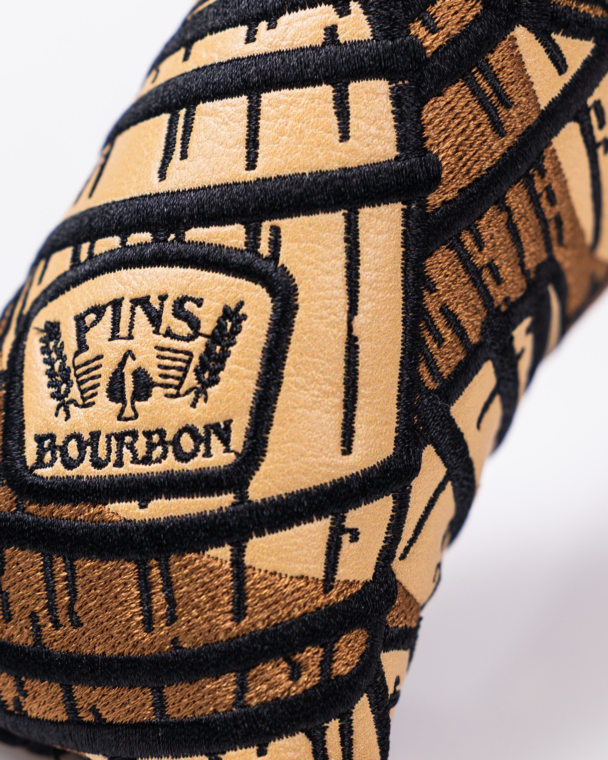 Bourbon Barrel Blade Putter Cover in rich brown leather with a rustic texture and stitched detailing.