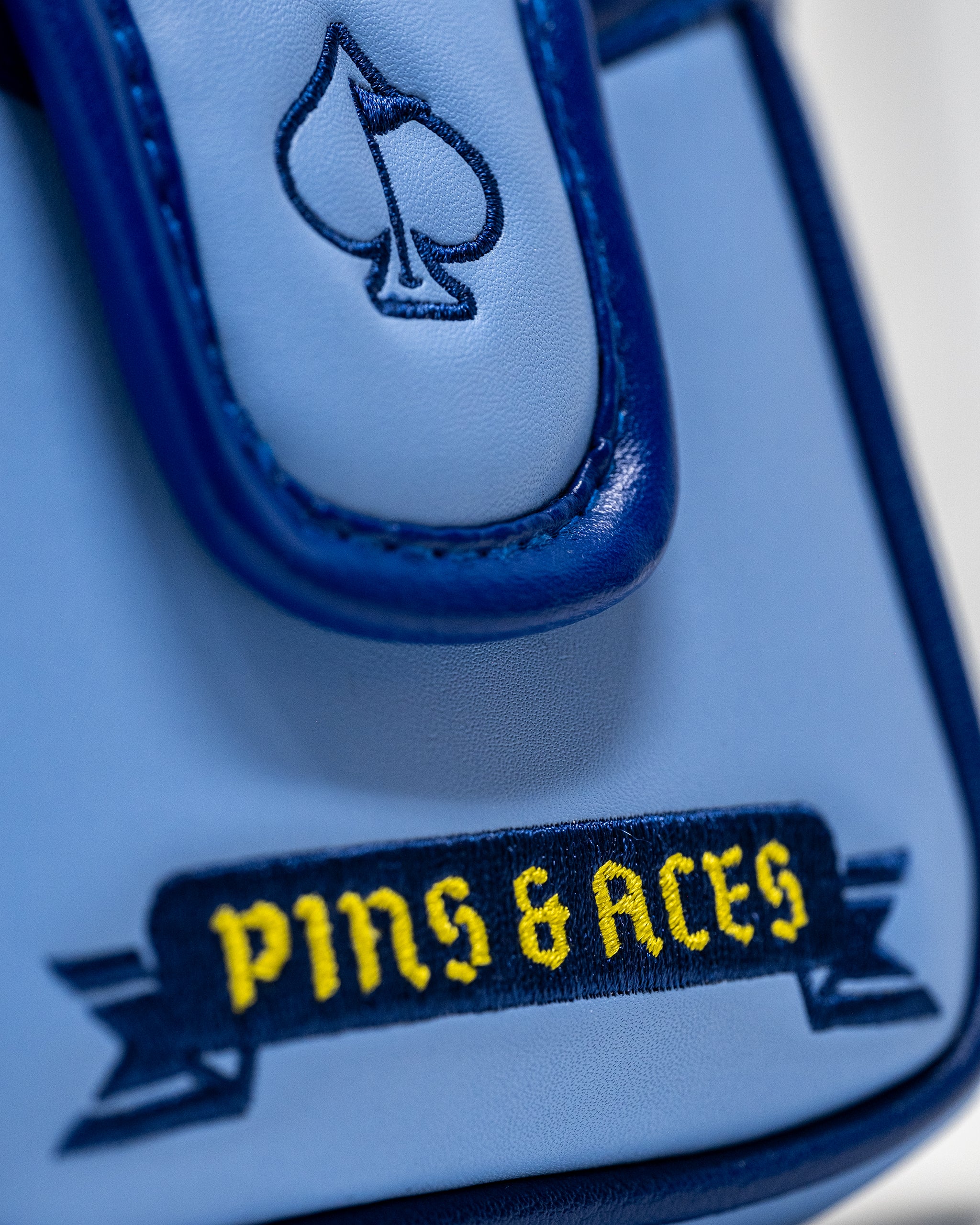 Coat of Arms mallet cover featuring a stylish design and durable material, perfect for protecting golf putters.