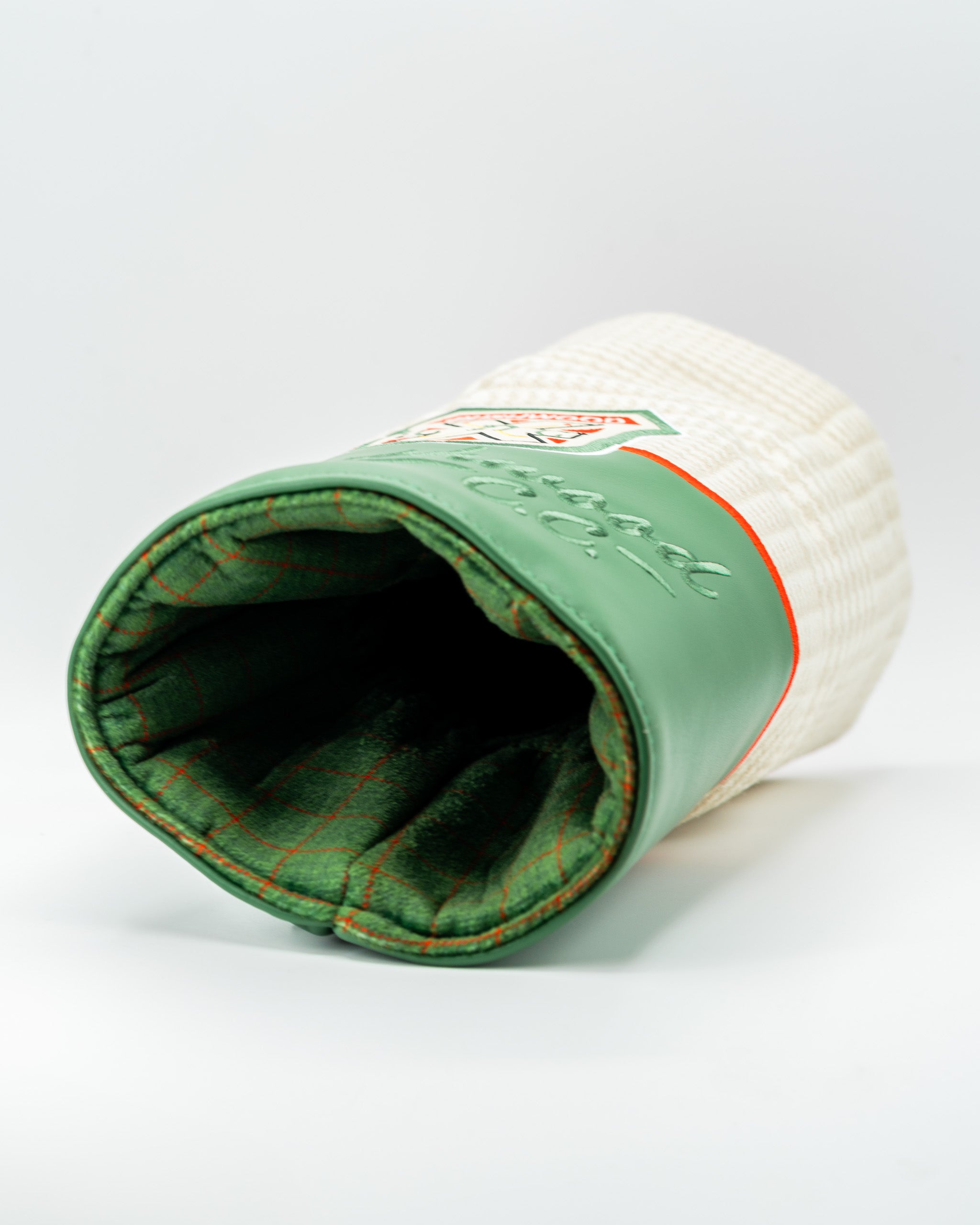 Bushwood CC driver cover featuring a textured cream exterior and a soft green interior, perfect for stylish golf protection.