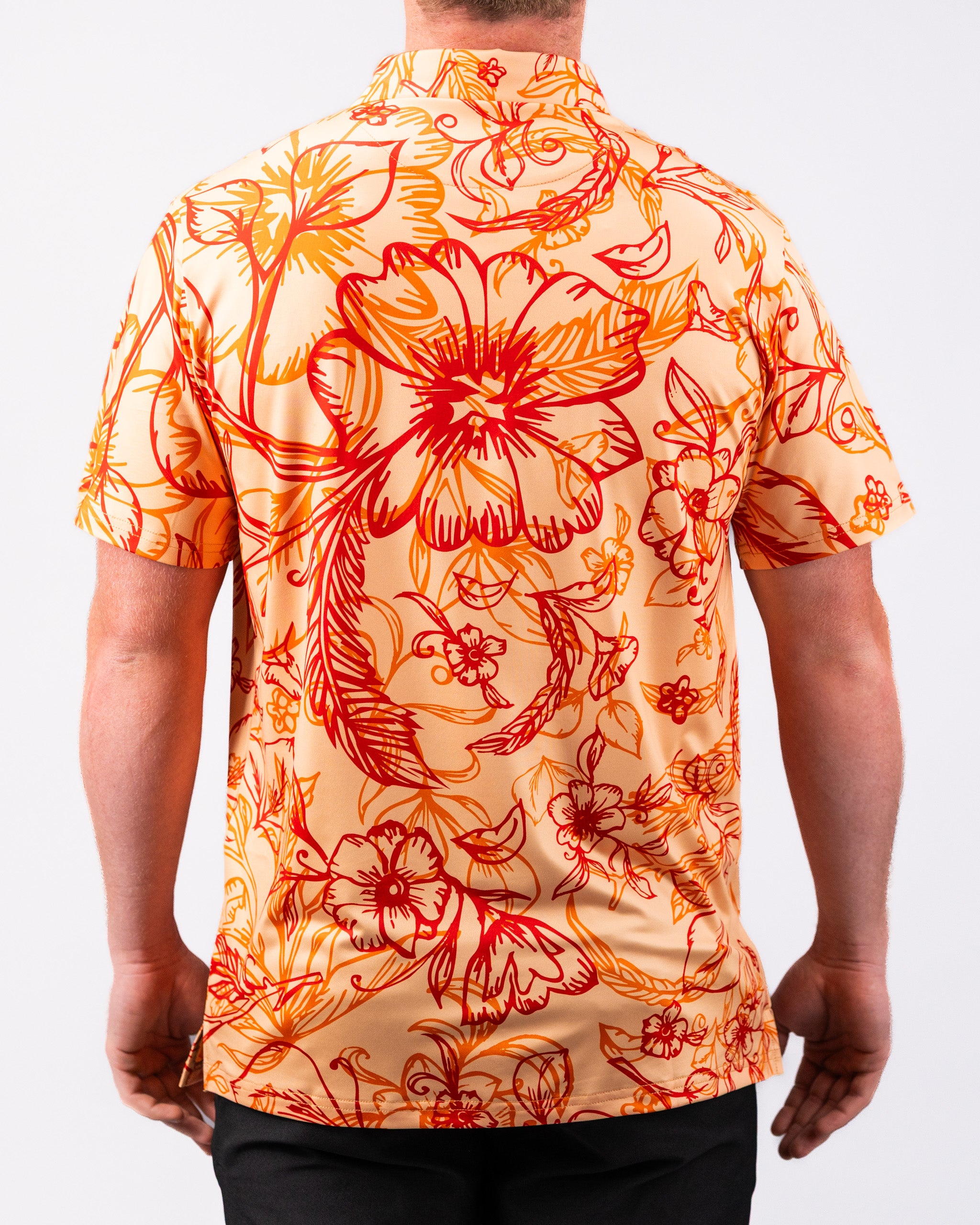 Cabo Sunburst Polo in vibrant orange with a sunburst design, featuring short sleeves and a classic collar.