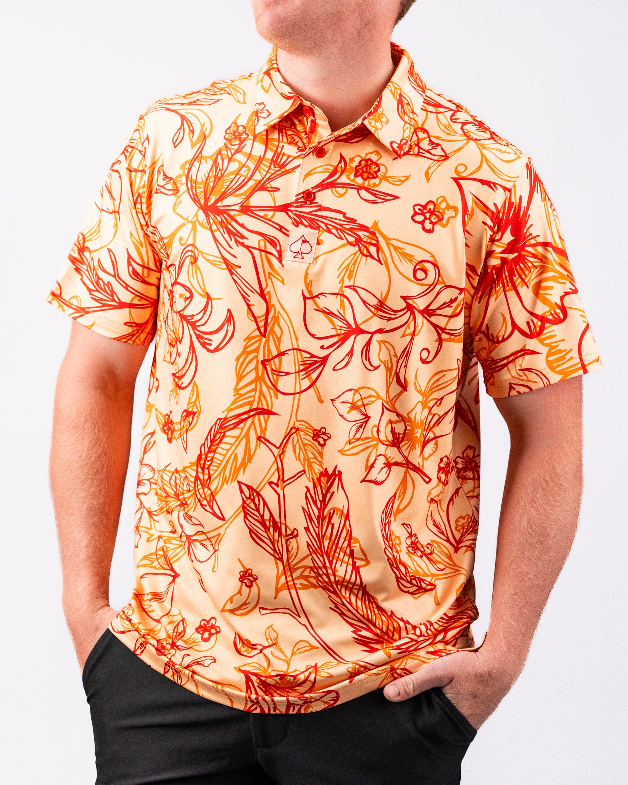 Cabo Sunburst polo shirt featuring a vibrant orange and yellow gradient design.