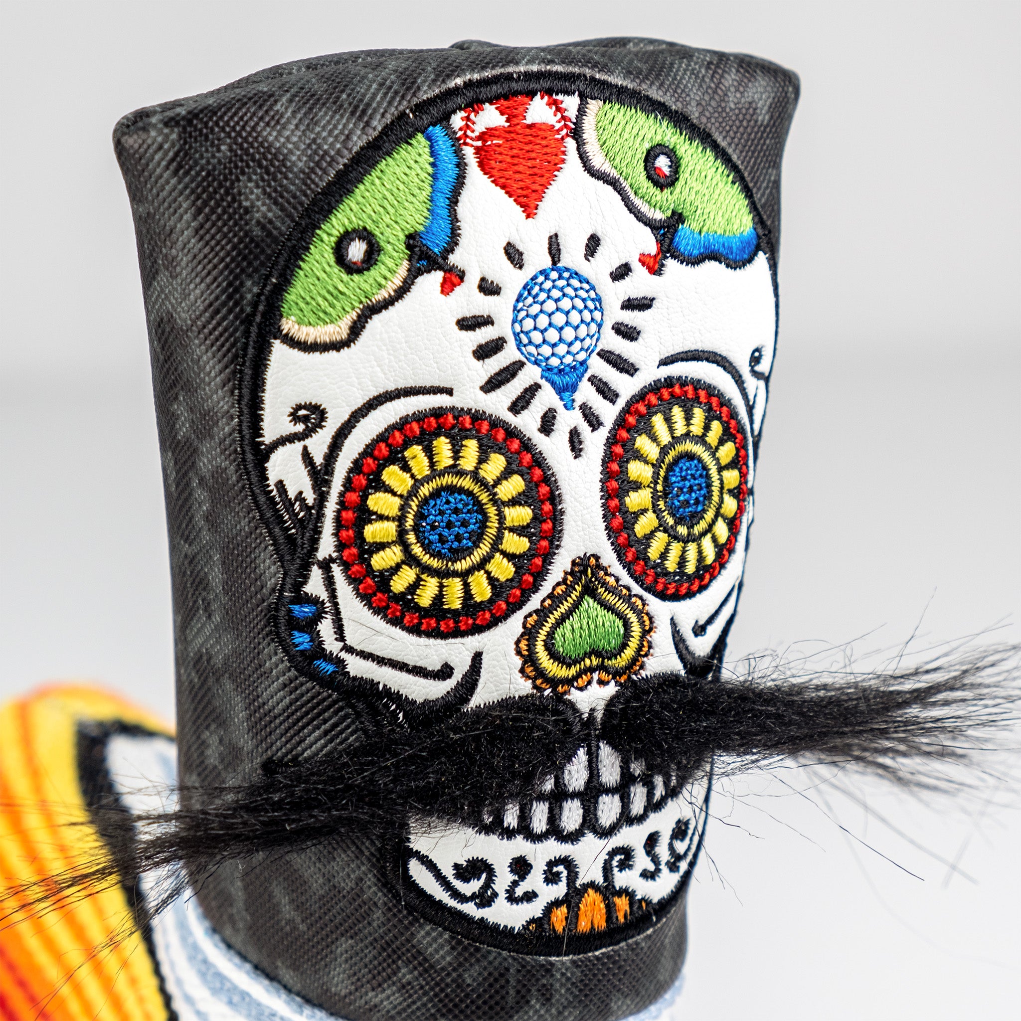 Colorful embroidered skull golf headcover with vibrant details, black base, and faux mustache for bold golf style.