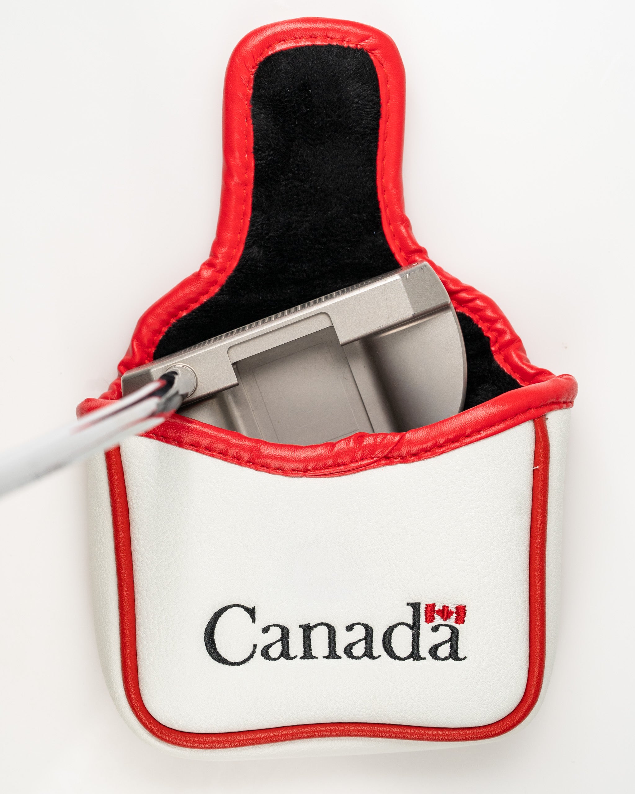 Canada mallet putter cover in white and red, featuring the word "Canada" and a flag emblem, with a putter inside.