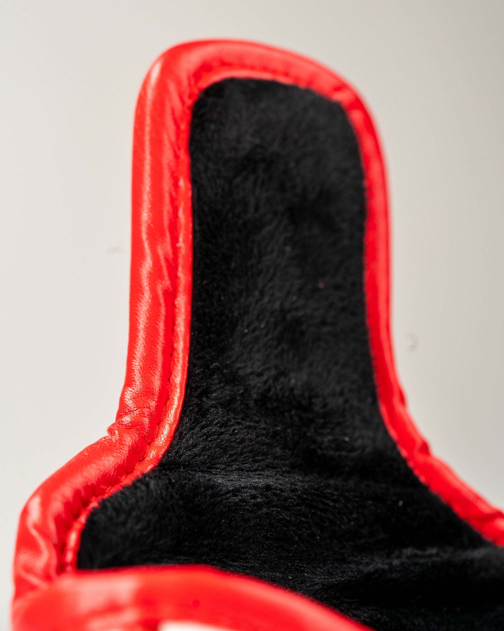 Red mallet putter cover featuring a soft black interior, designed to protect and style your golf equipment.