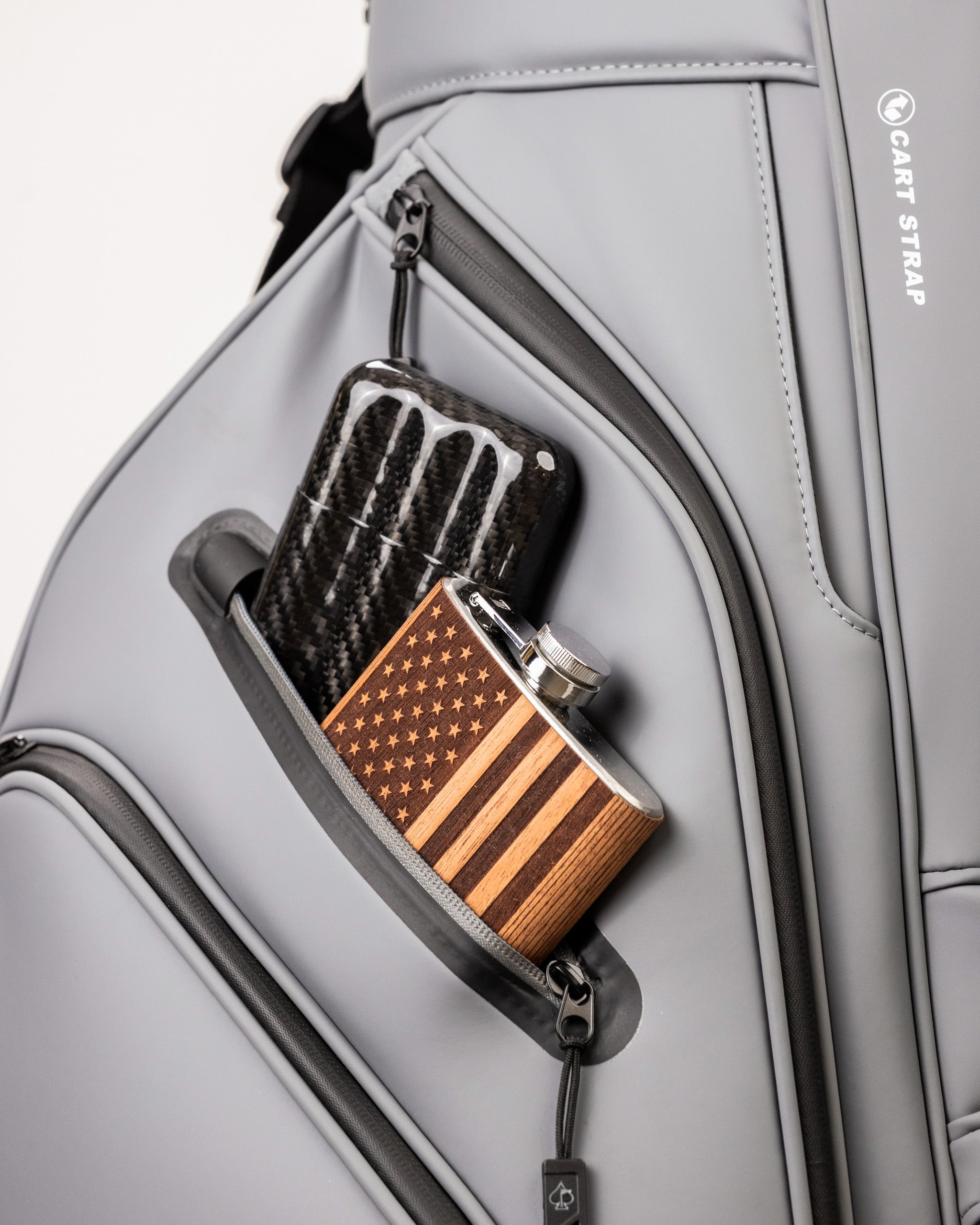 Player Preferred™ Cart Bag in Flat Ash color, featuring multiple zippered pockets and a comfortable shoulder strap, displayed against a neutral background.