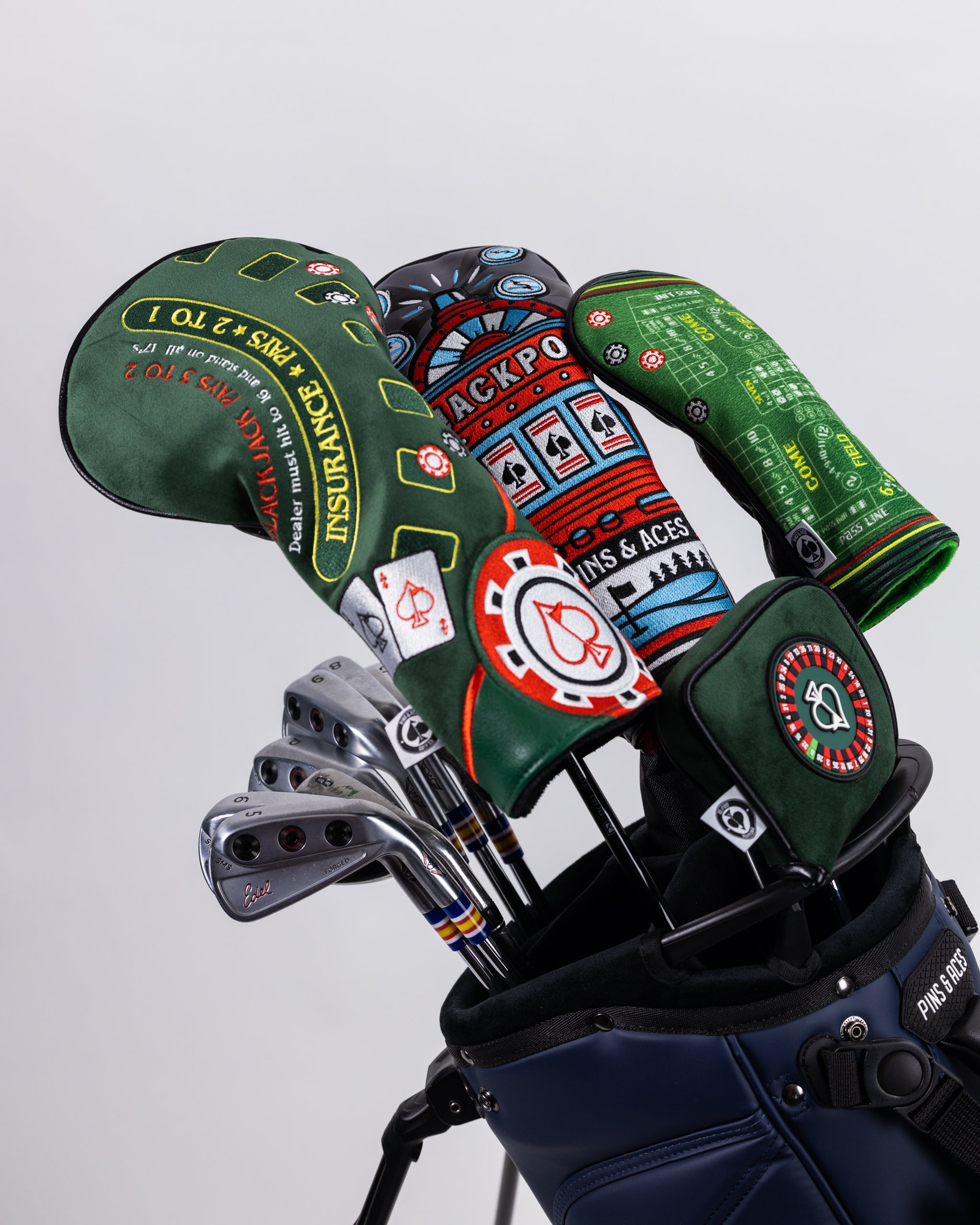 Colorful golf club headcovers with bold casino and gambling-themed designs, perfect for standout golf accessories.