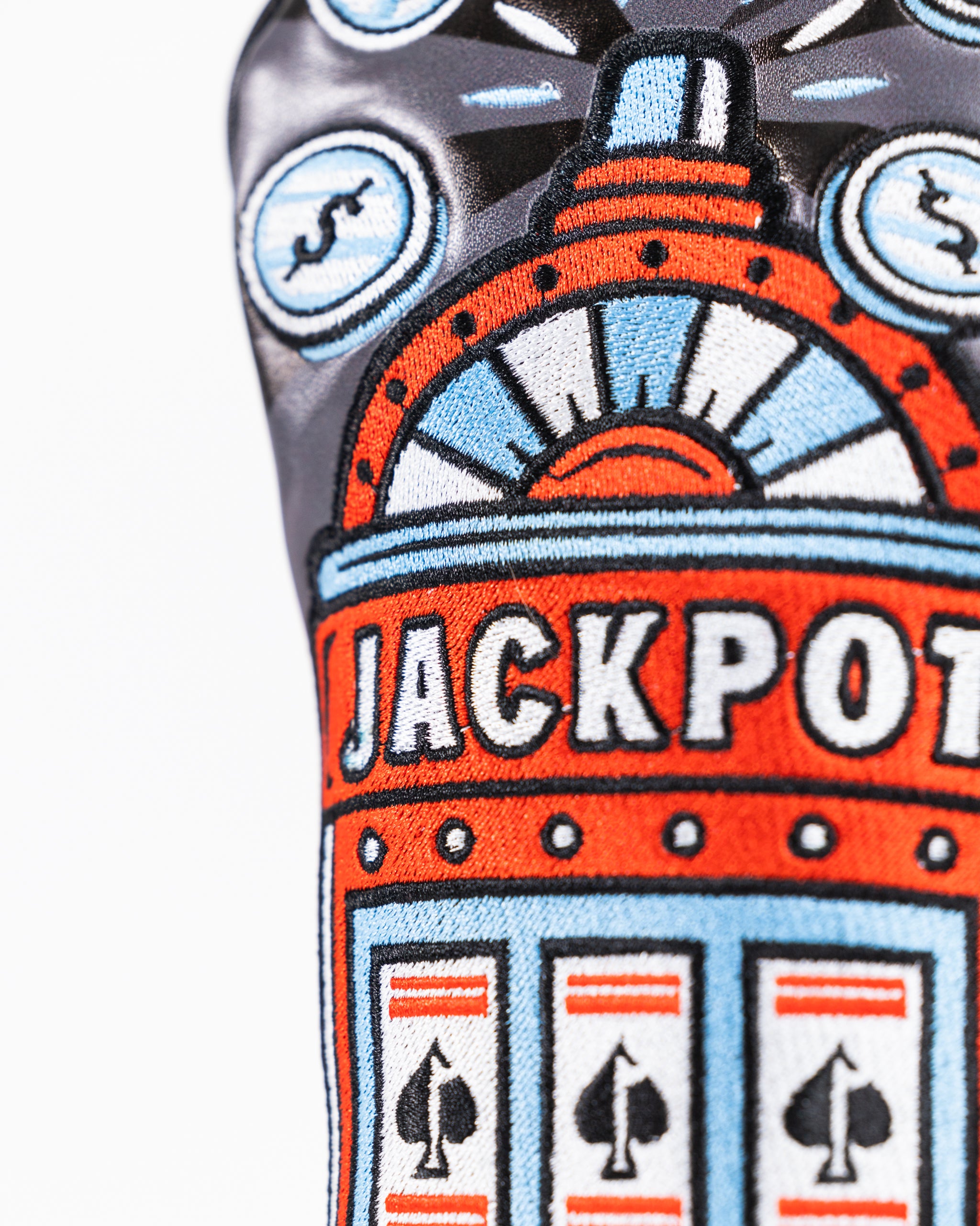 Casino-themed fairway cover featuring a vibrant slot machine design with colorful symbols and a soft fabric texture.