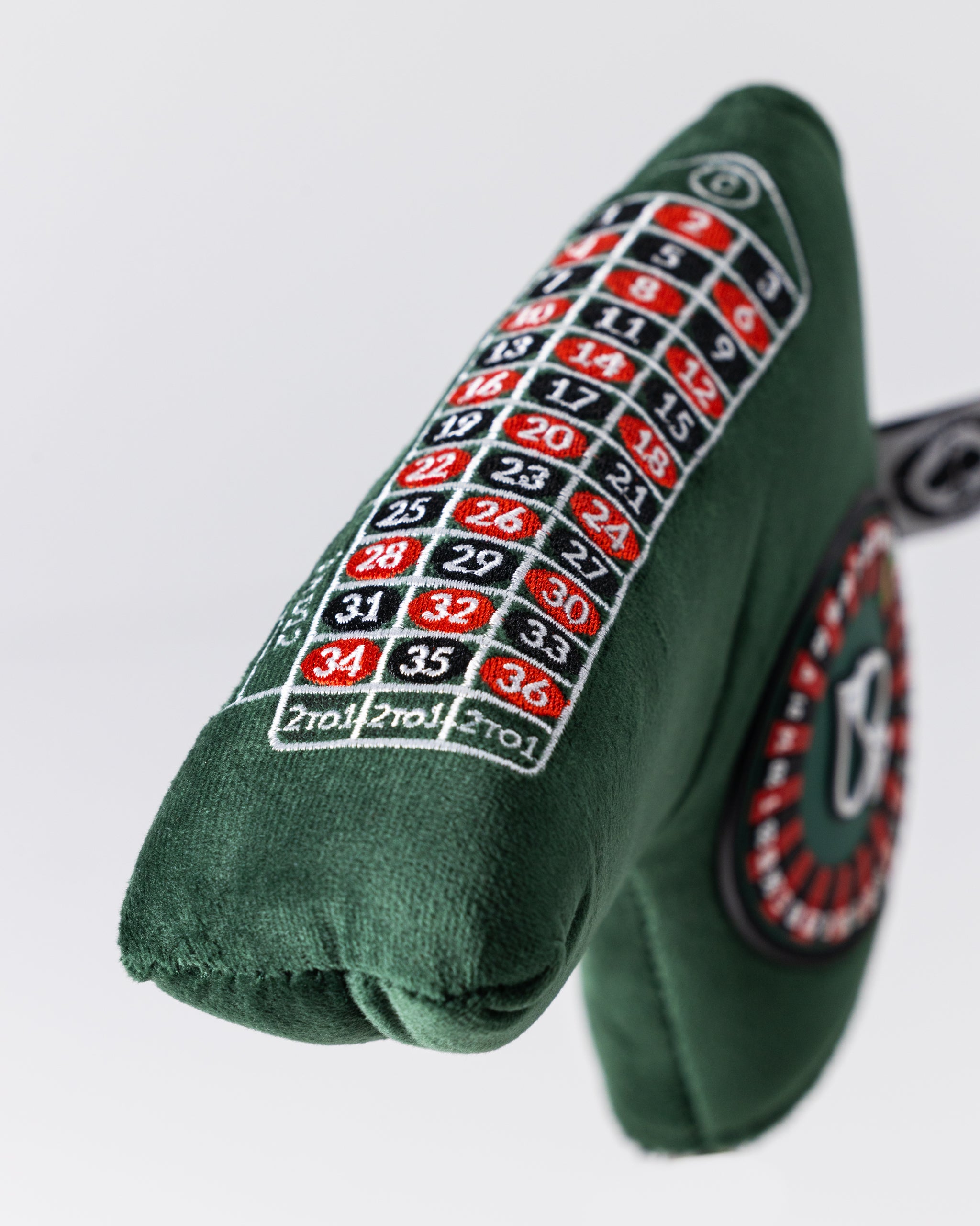 Alt text: "Roulette-themed blade putter cover with vibrant colors and casino motif."
