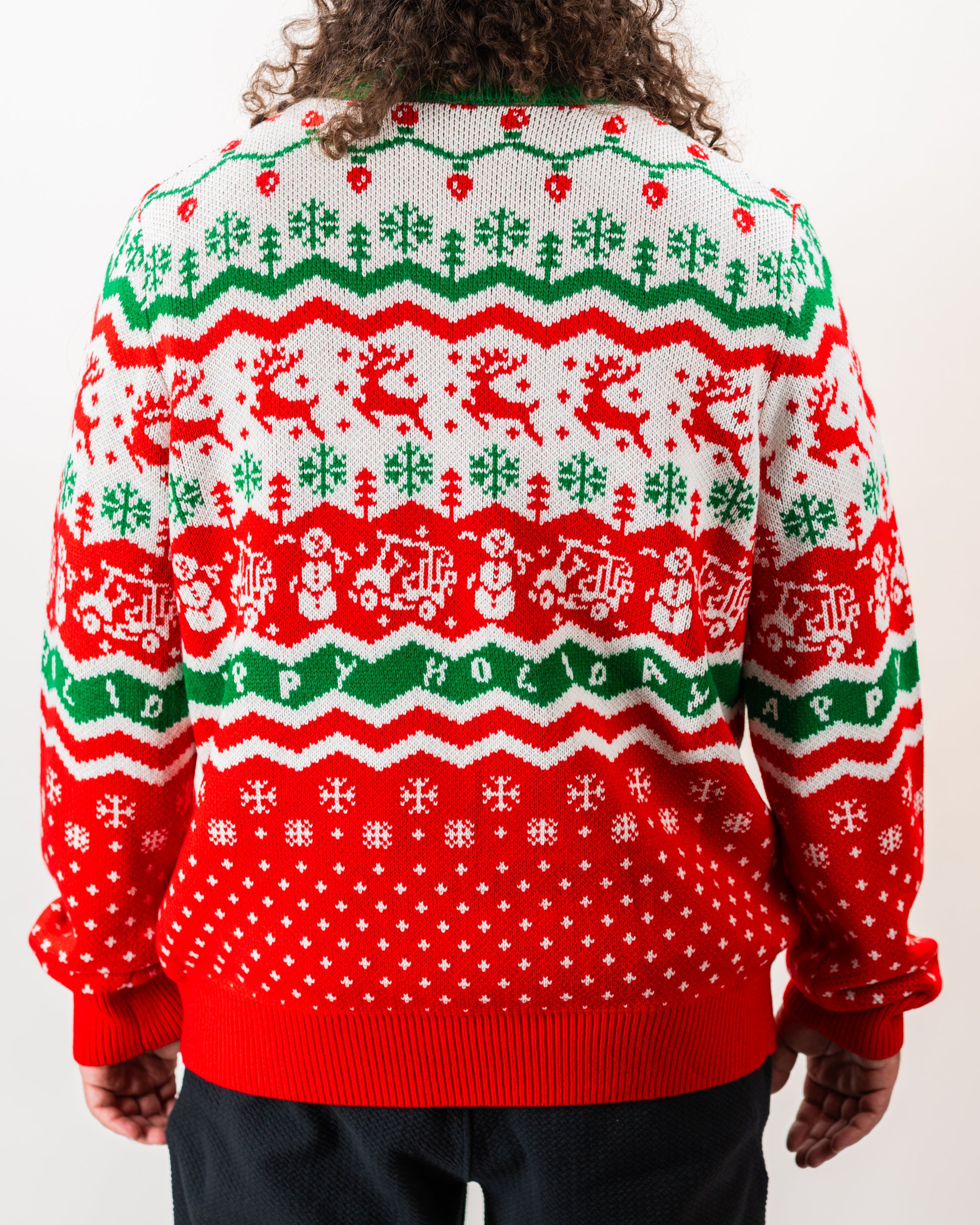 Alt text: "Pins & Aces 2024 Ugly Sweater featuring a festive design with playful holiday motifs."