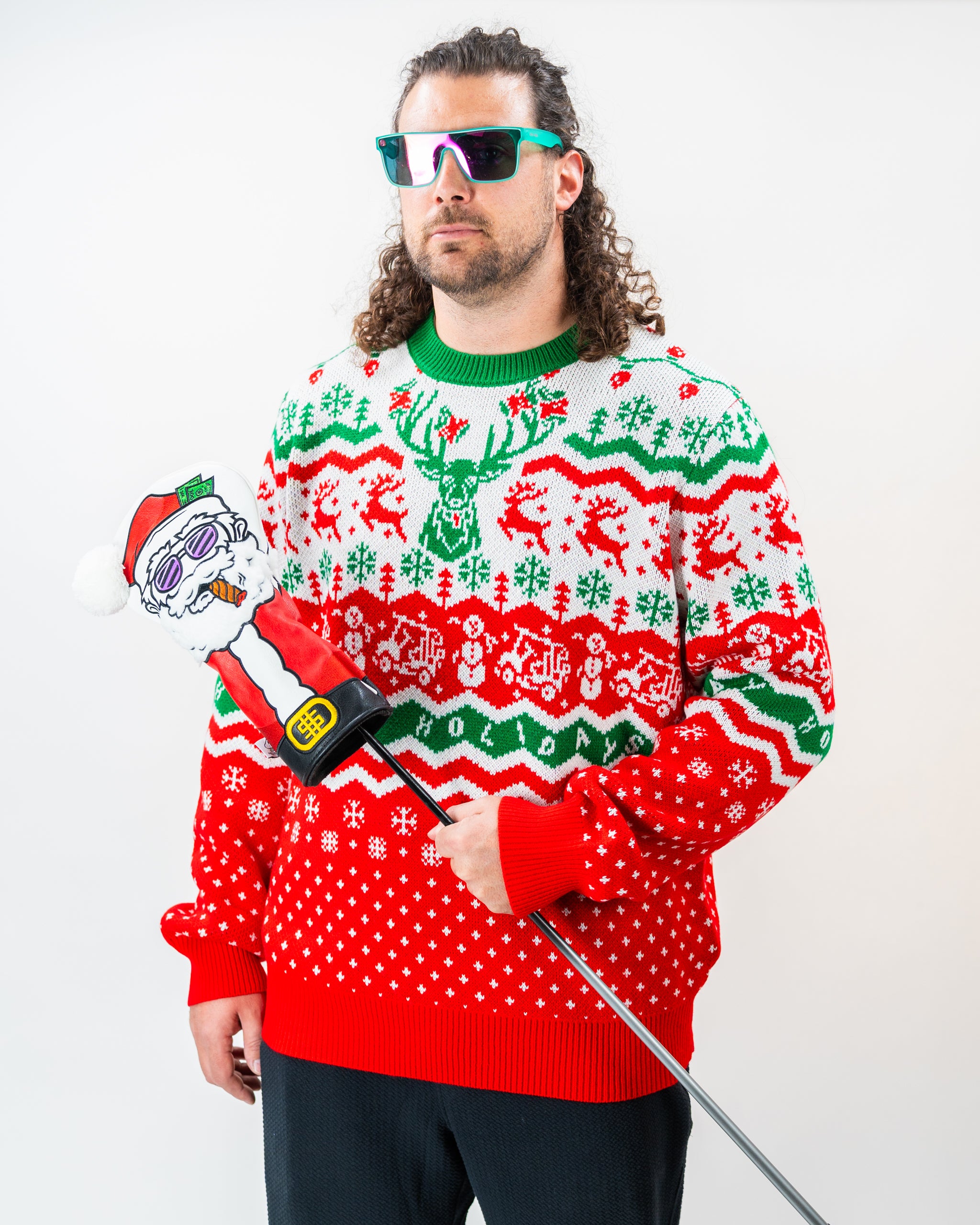 Alt text: "Pins & Aces 2024 Ugly Sweater featuring colorful Christmas-themed design with golf motifs, prominently displayed on a festive background."