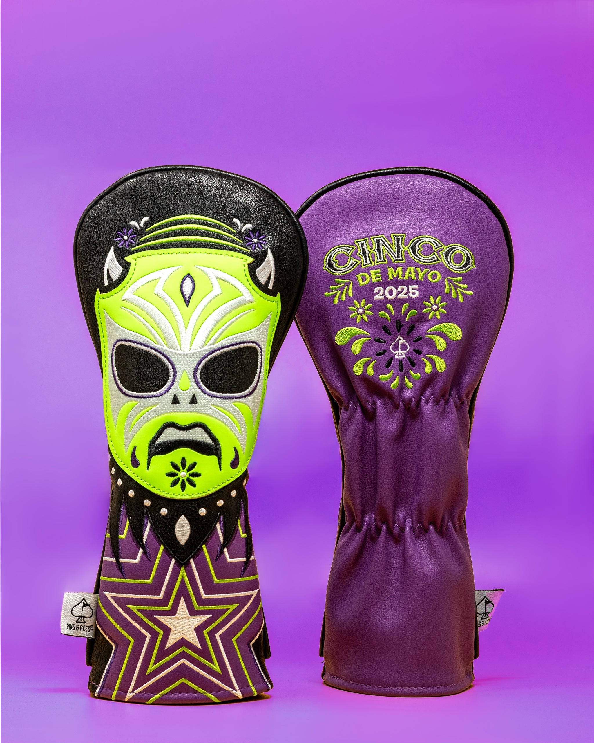 Lucha Libre mask-themed golf club cover with vibrant purple, green, and black colors, featuring a skull design and Cinco de Mayo 2025 embroidery.