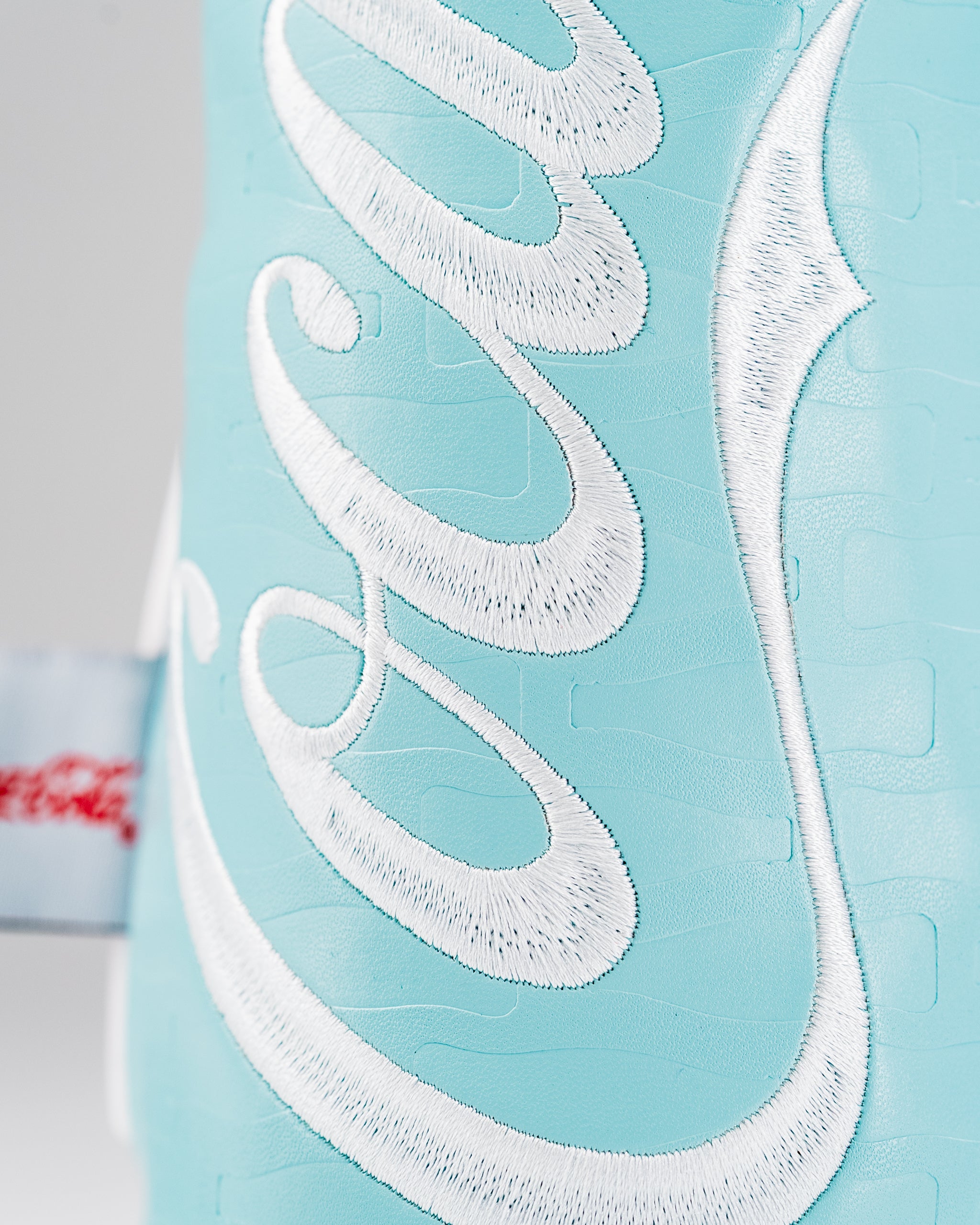 Coca-Cola fairway cover featuring a vibrant blue design with white embroidered logo, perfect for stylish golfers.