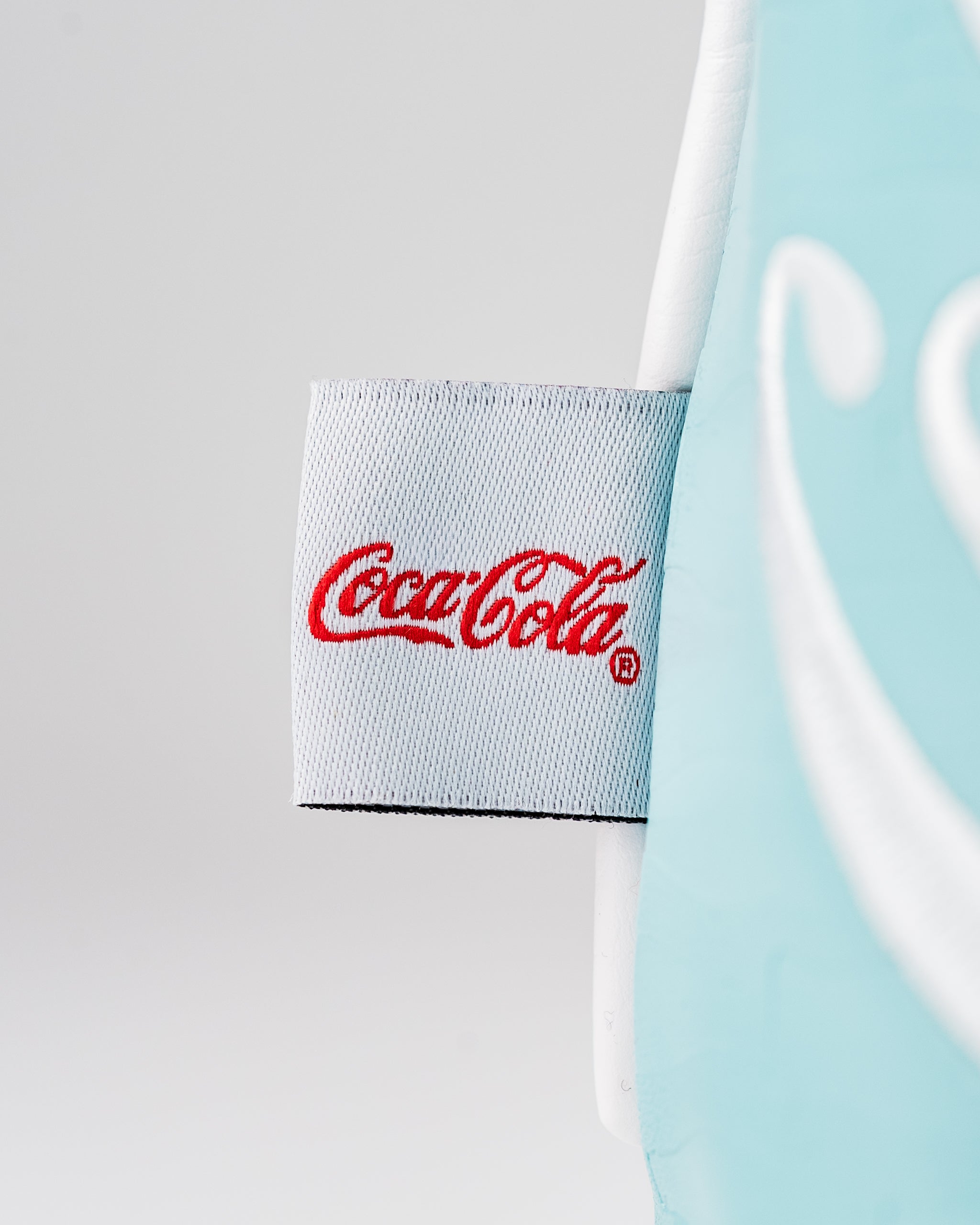 Coca-Cola fairway cover featuring a vibrant design and logo, perfect for adding style to your golf game.