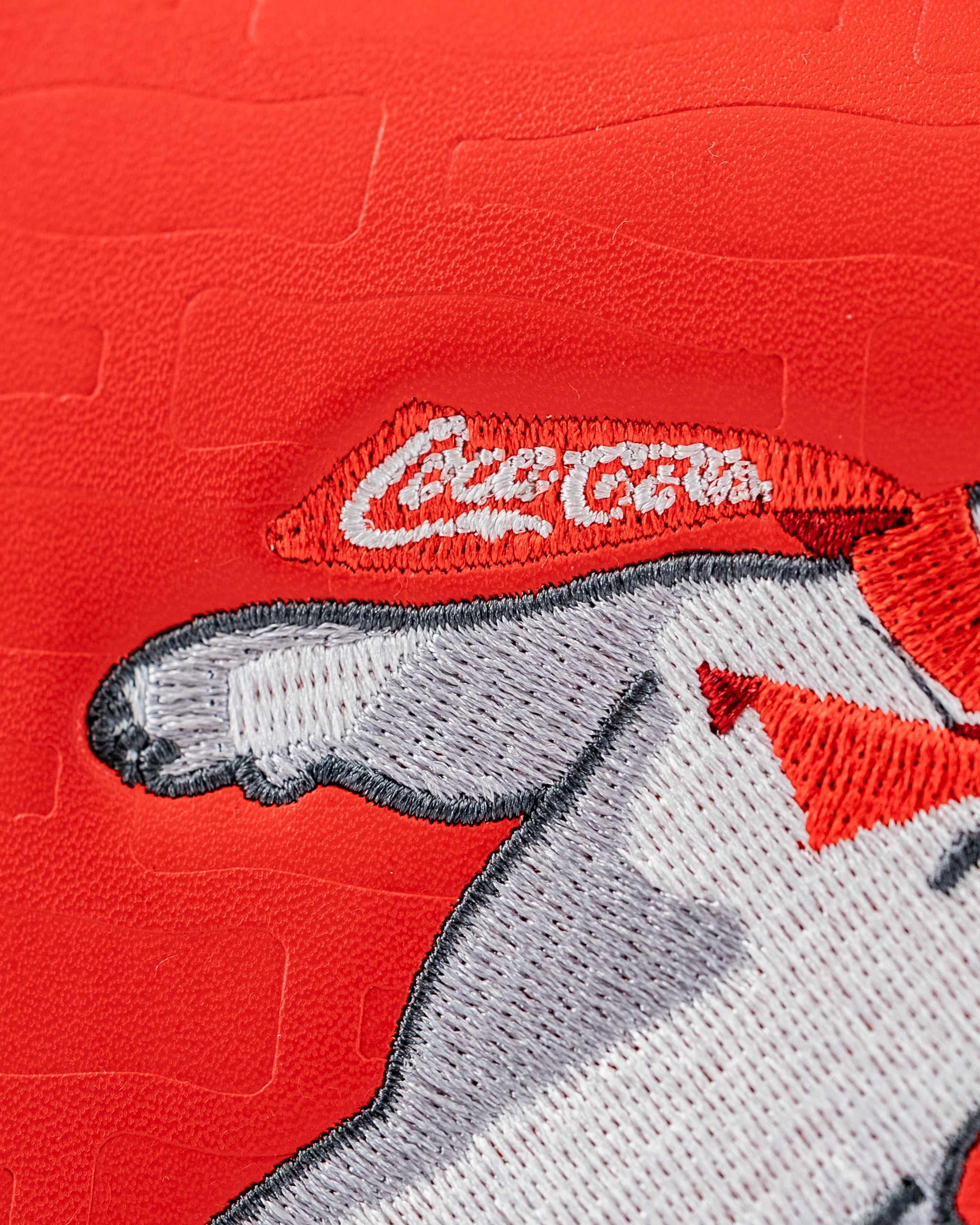 Coca-Cola mallet putter cover featuring an embroidered design of a polar bear with a red scarf.