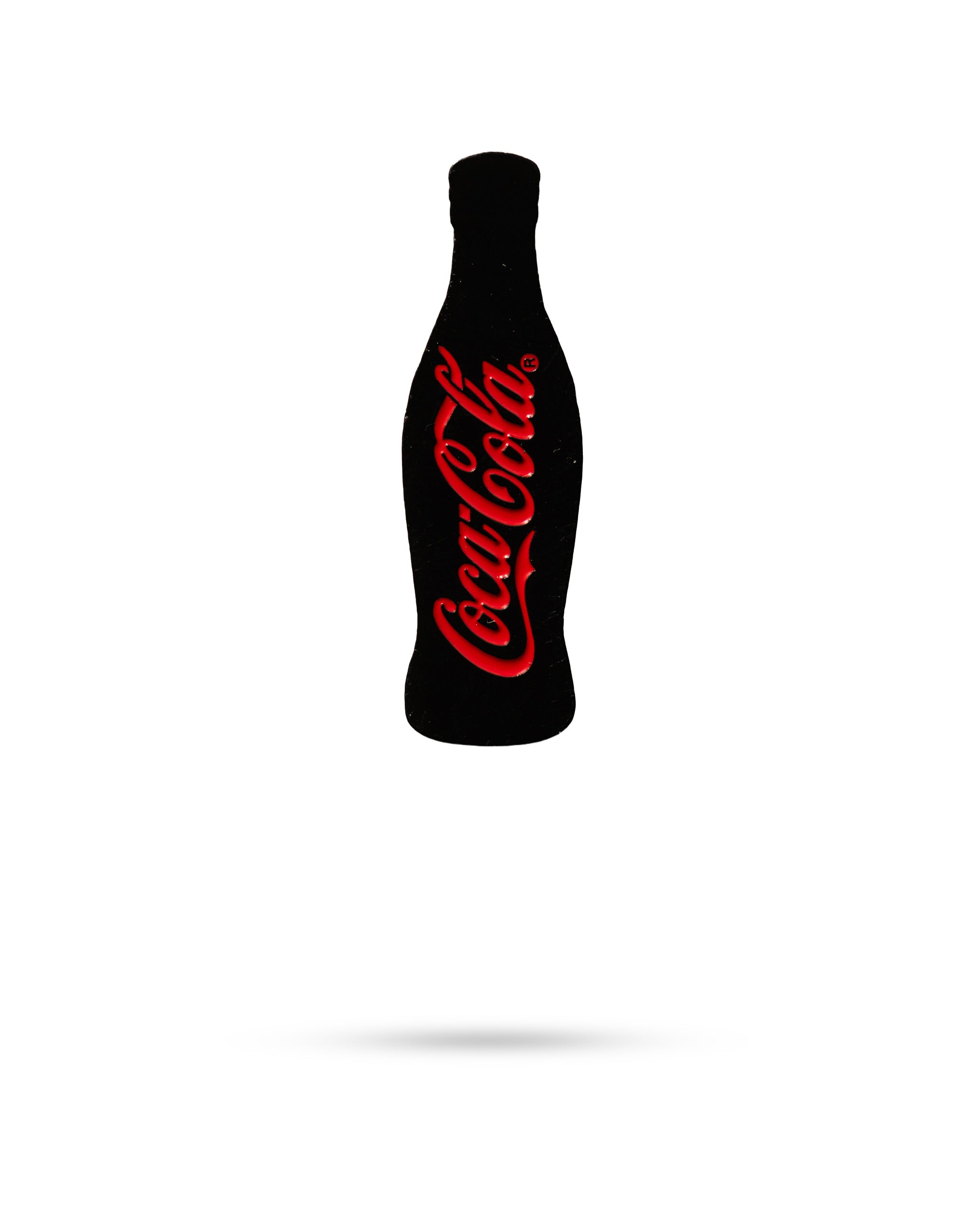 Coca-Cola bottle-shaped ball marker featuring the iconic logo, perfect for adding style to your golf game.